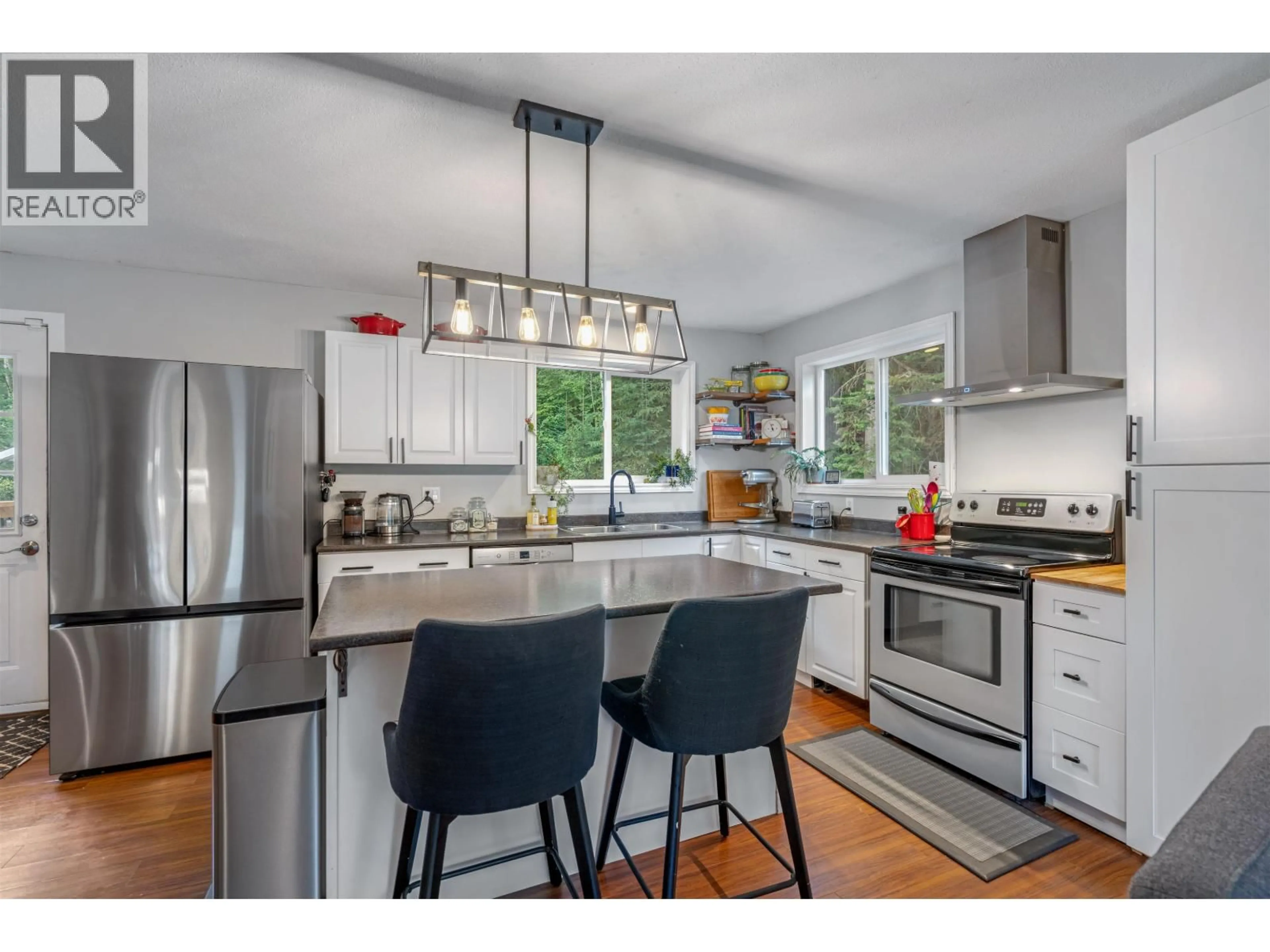 Open concept kitchen, wood/laminate floor for 2971 MINOTTI DRIVE, Prince George British Columbia V2K3S6