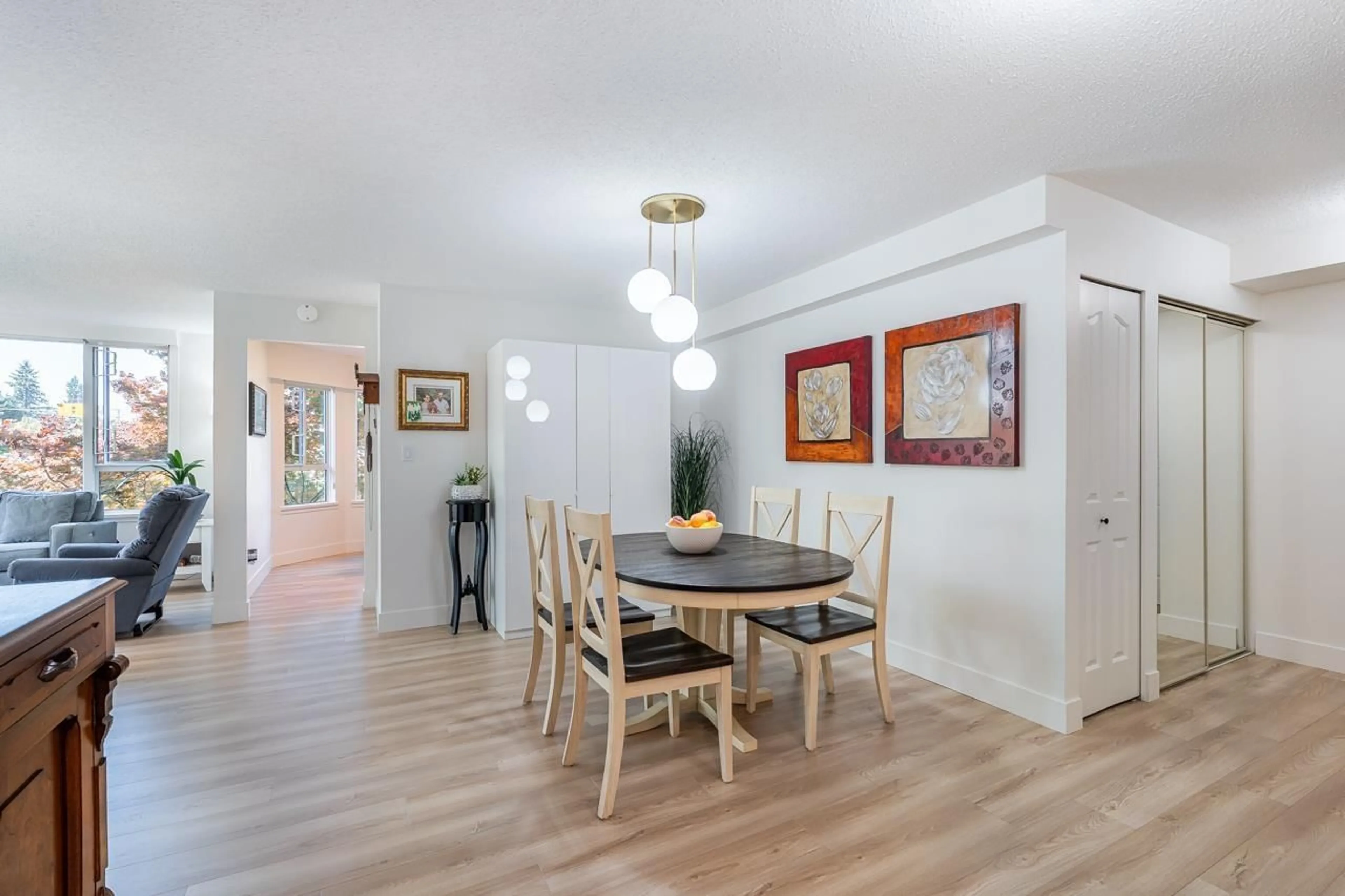 Dining room, wood/laminate floor for 201 - 3150 GLADWIN ROAD, Abbotsford British Columbia V2T5S9