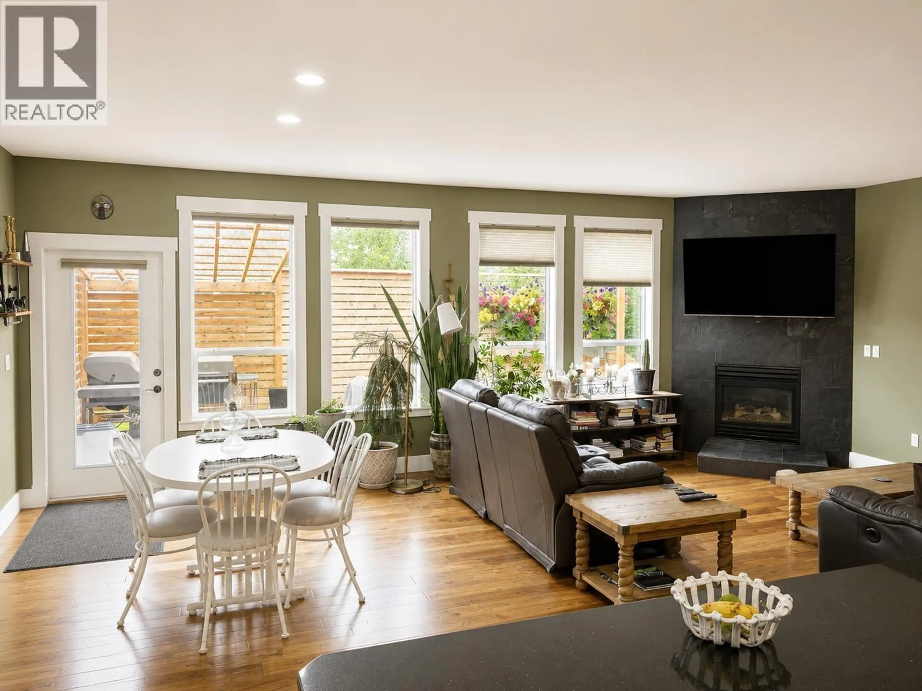 Living room with furniture, wood/laminate floor for 11019 114 AVENUE, Fort St. John British Columbia V1J0N4