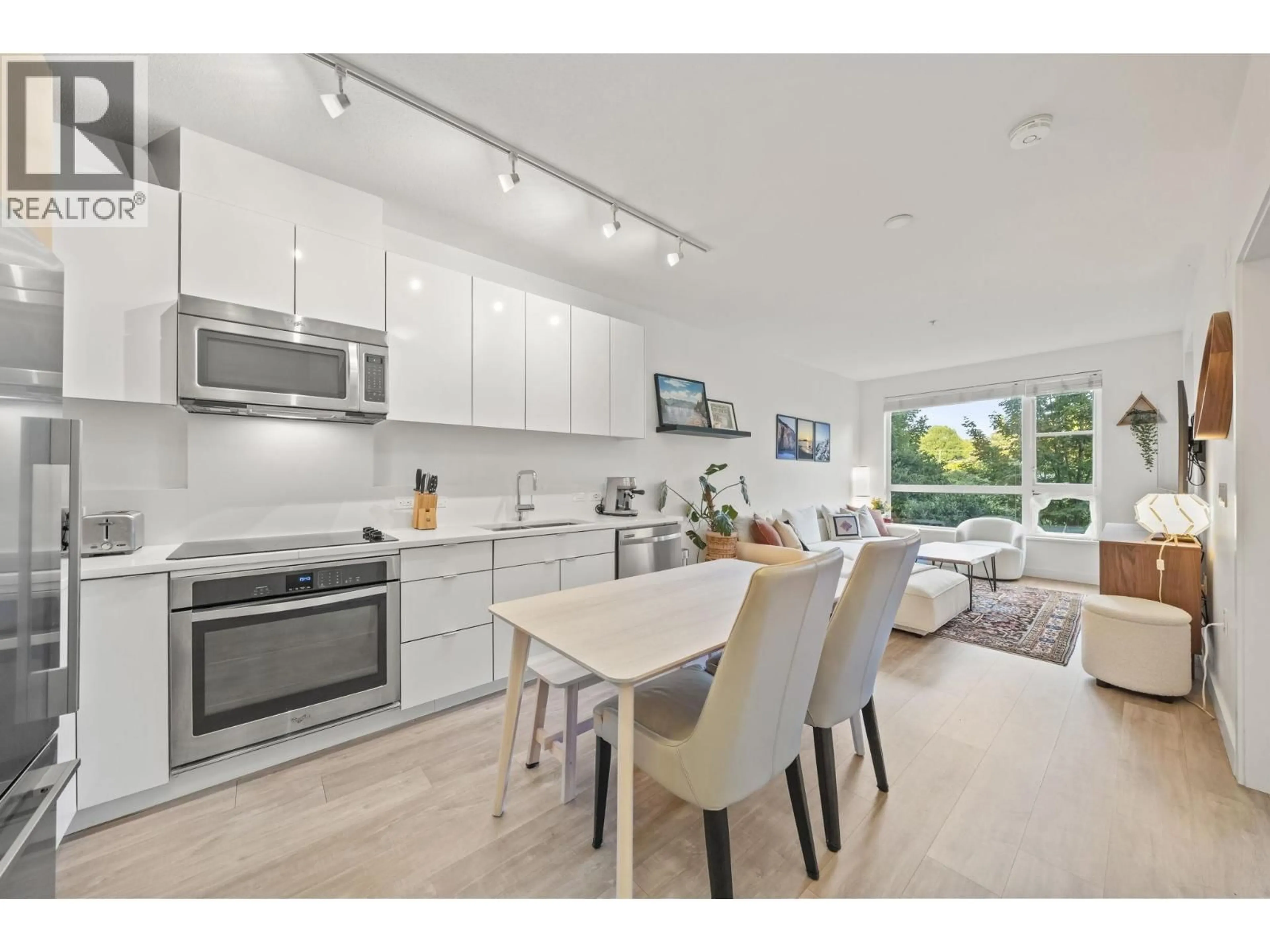Open concept kitchen, unknown for 214 - 1621 HAMILTON AVENUE, North Vancouver British Columbia V7P0B6