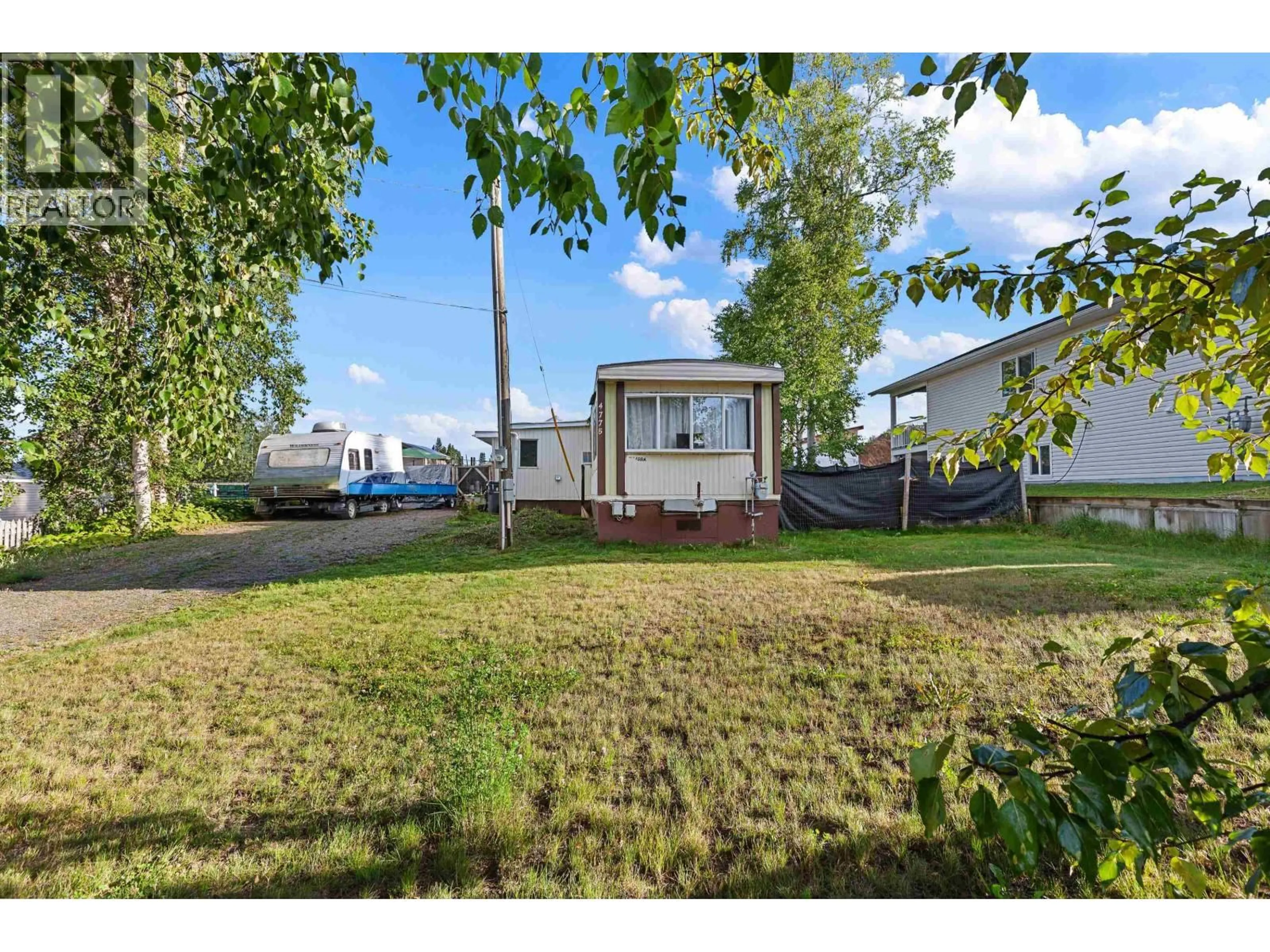A pic from outside/outdoor area/front of a property/back of a property/a pic from drone, street for 4775 HANDLEN ROAD, Prince George British Columbia V2K2J7