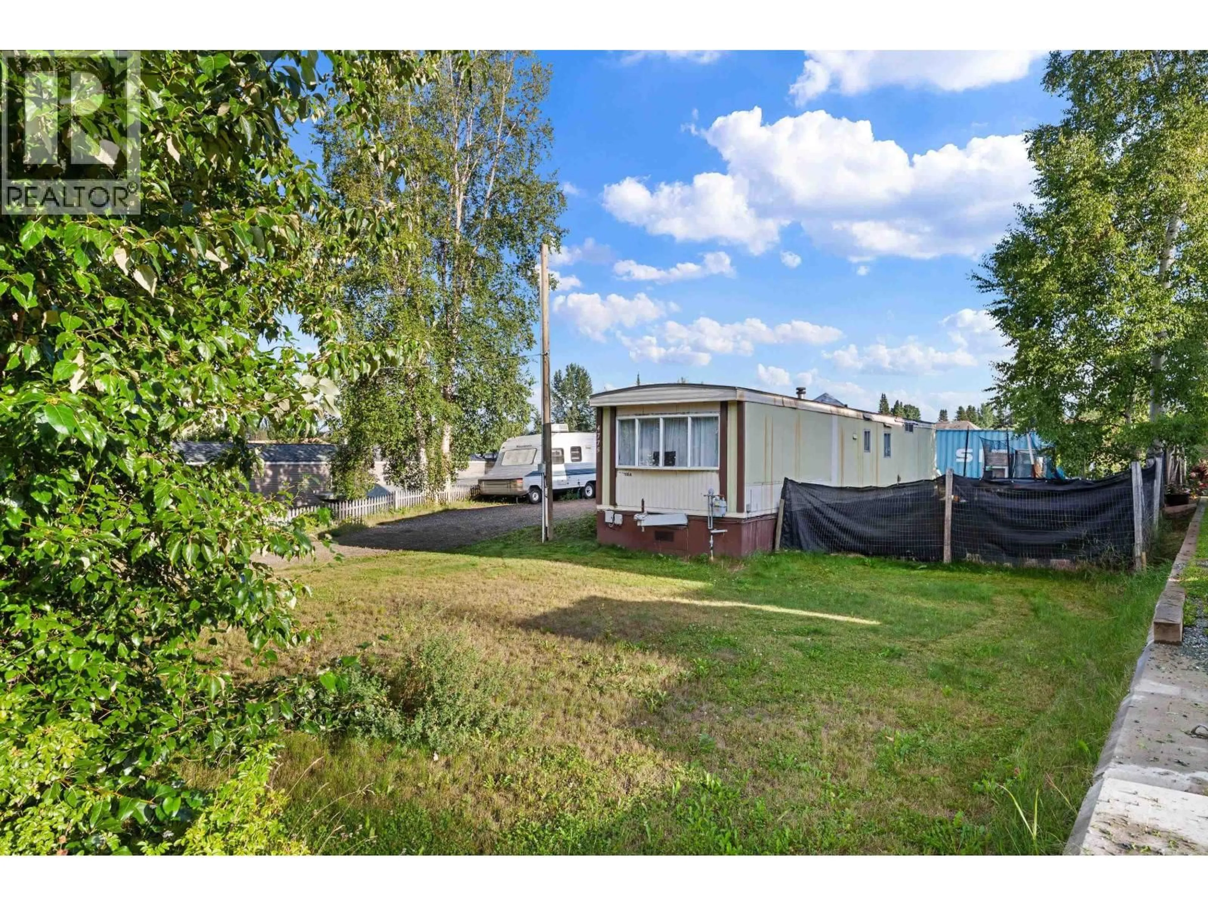 A pic from outside/outdoor area/front of a property/back of a property/a pic from drone, street for 4775 HANDLEN ROAD, Prince George British Columbia V2K2J7