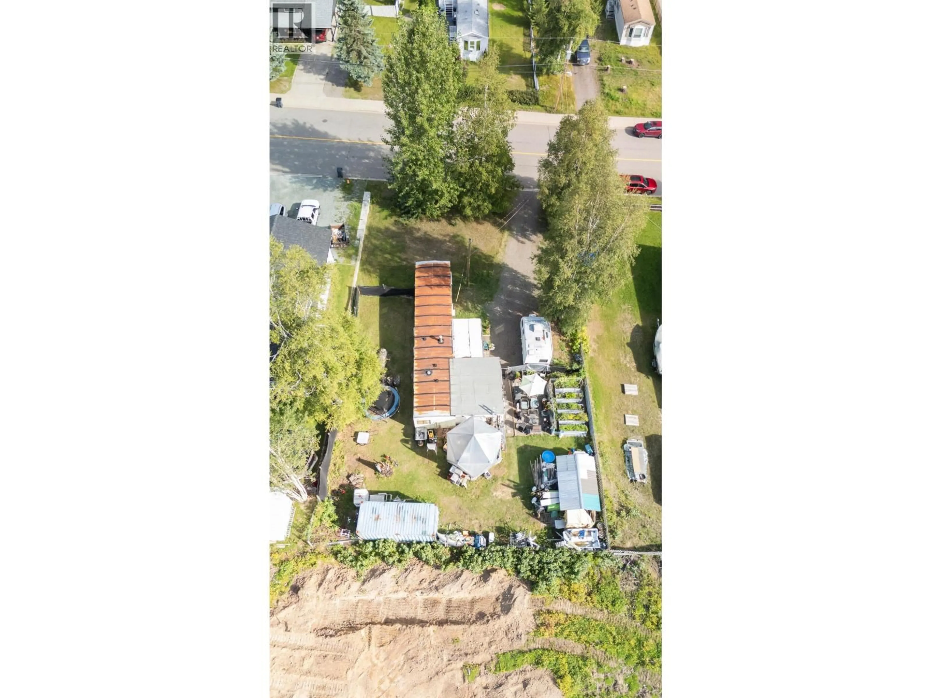 A pic from outside/outdoor area/front of a property/back of a property/a pic from drone, street for 4775 HANDLEN ROAD, Prince George British Columbia V2K2J7