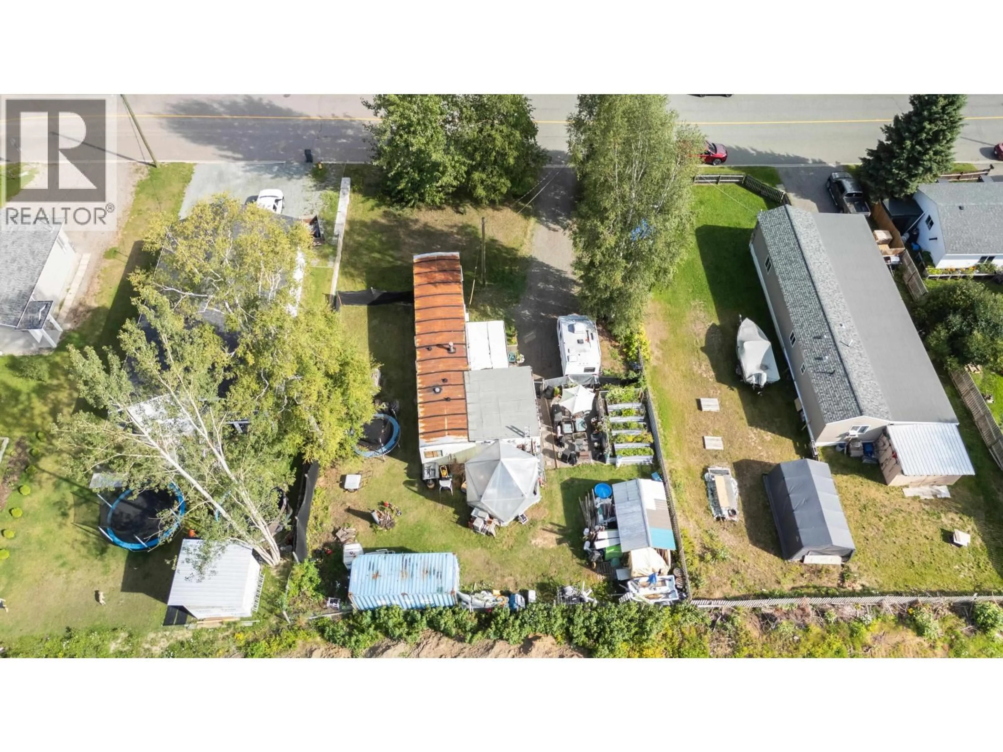 A pic from outside/outdoor area/front of a property/back of a property/a pic from drone, street for 4775 HANDLEN ROAD, Prince George British Columbia V2K2J7