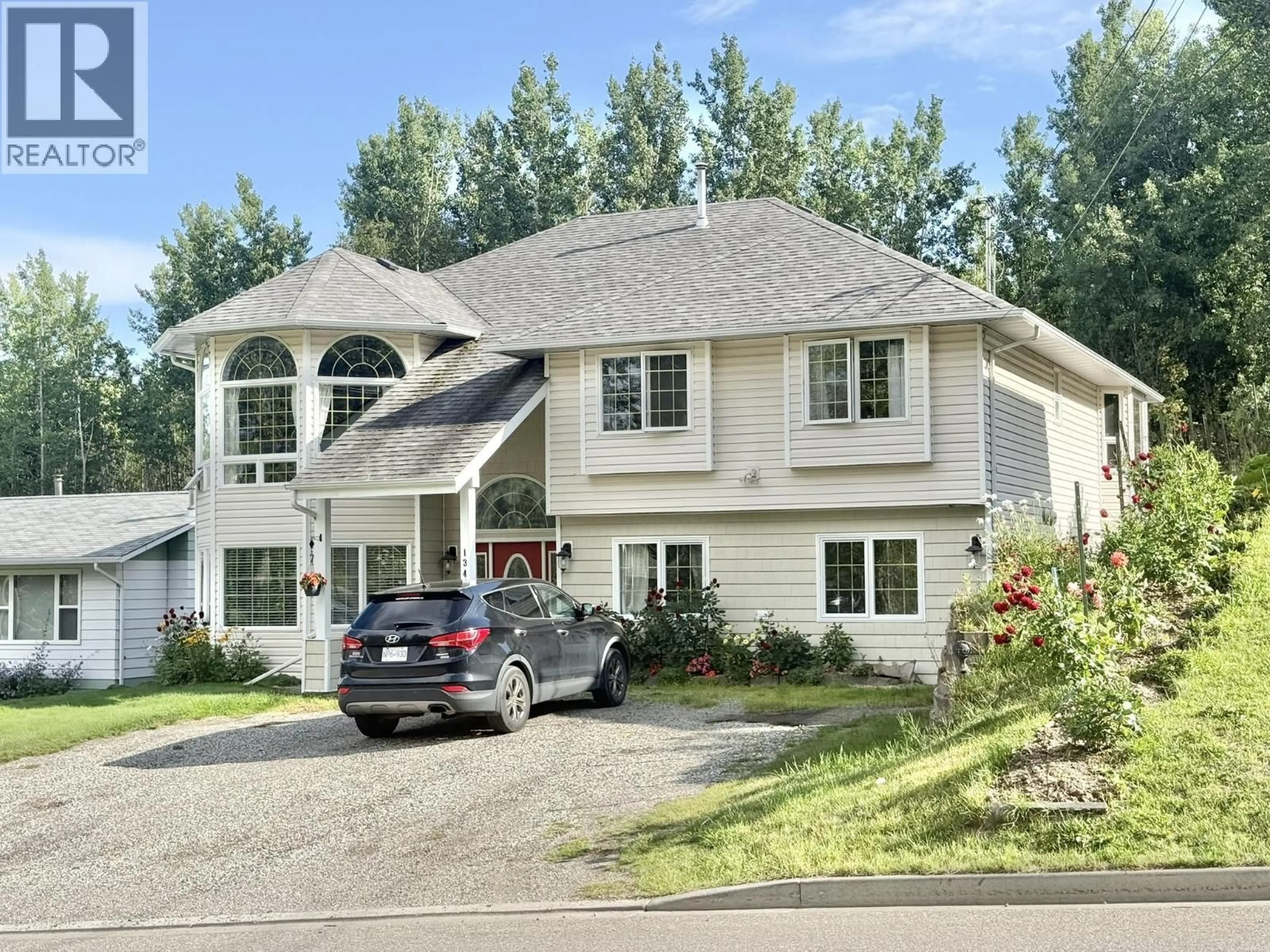 Home with vinyl exterior material, street for 1346 ABBOTT ROAD, Quesnel British Columbia V2J1J2