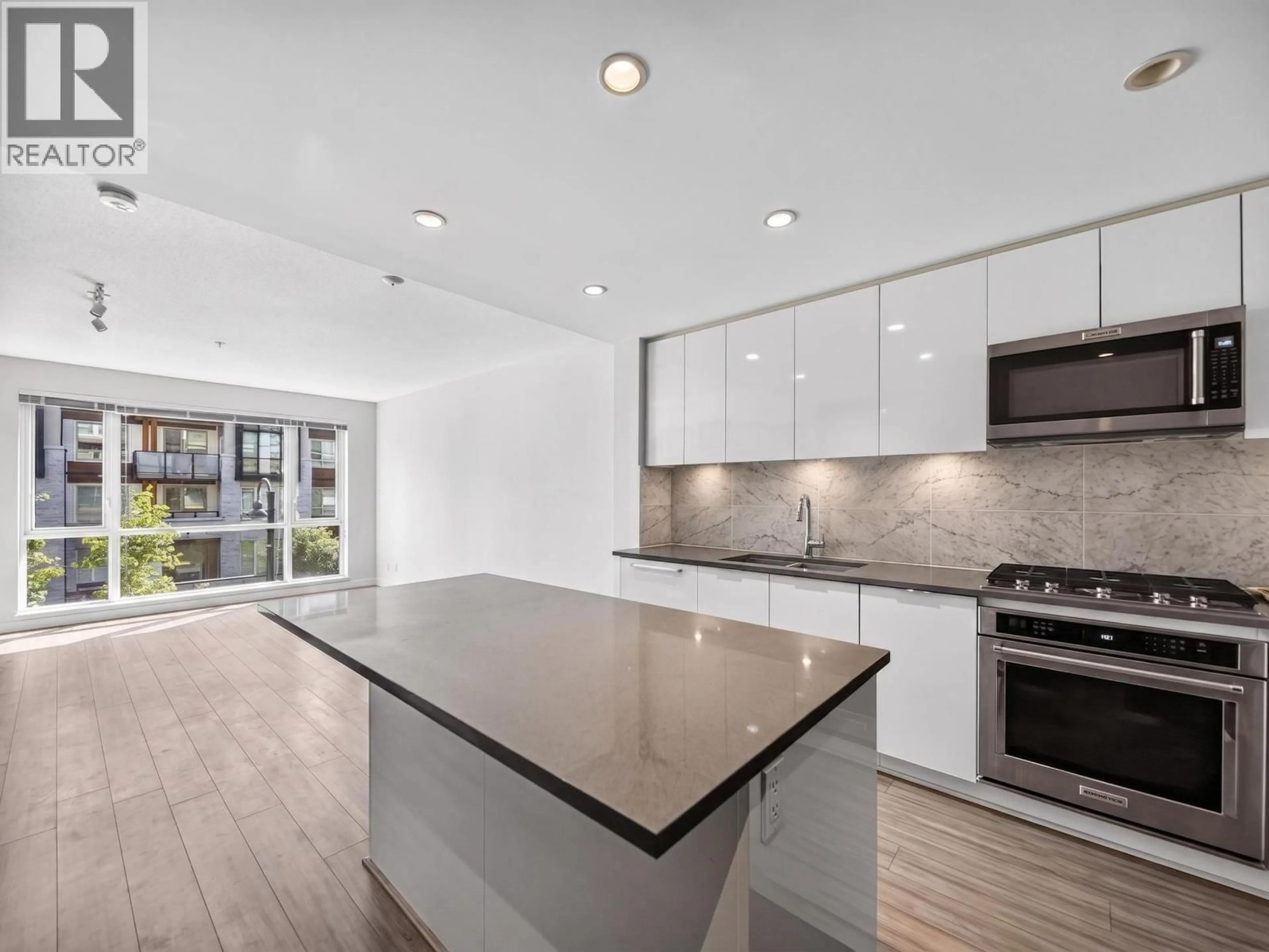 Open concept kitchen, ceramic/tile floor for 204 - 2651 LIBRARY LANE, North Vancouver British Columbia V7J0C1