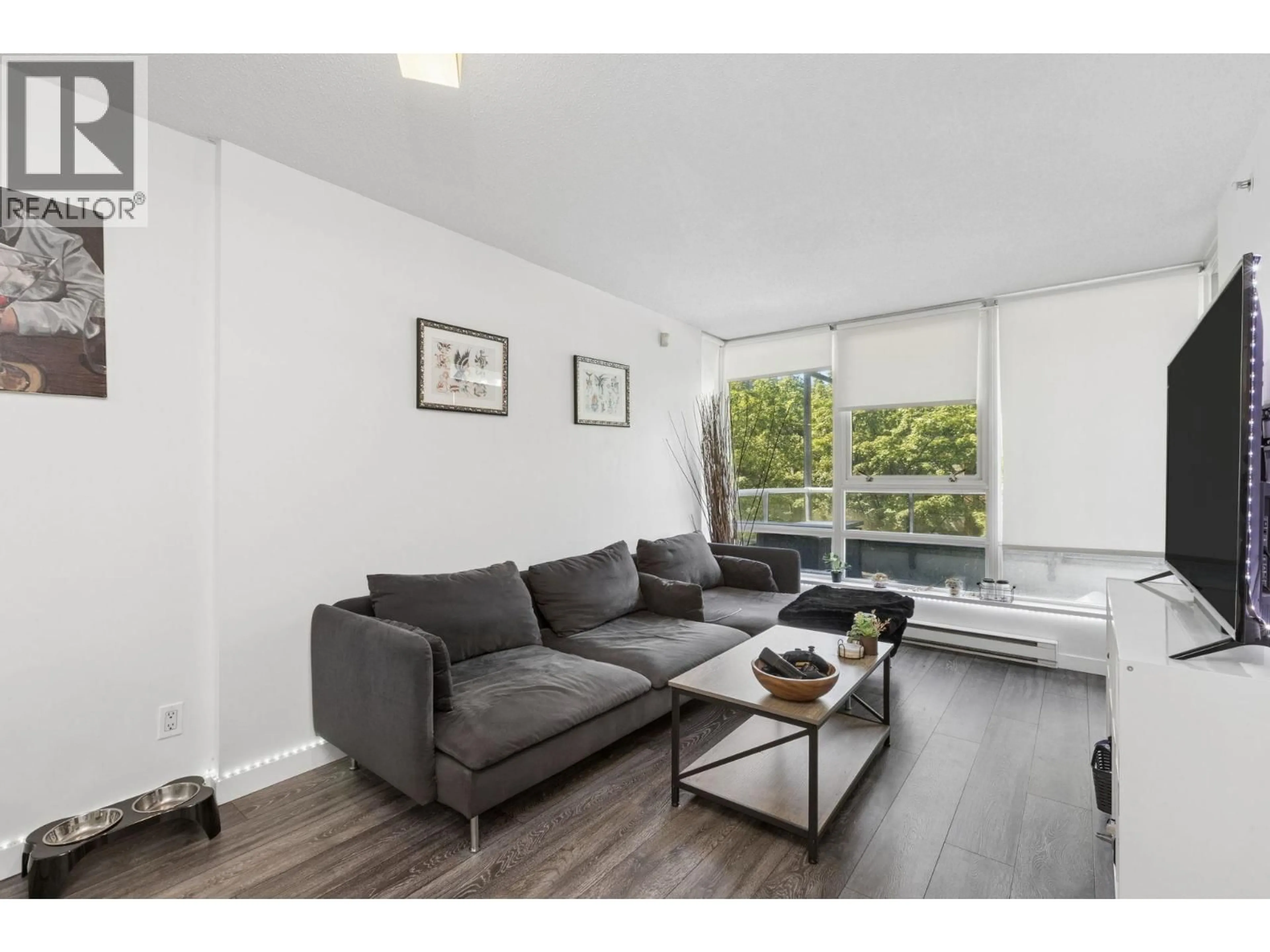 Living room with furniture, wood/laminate floor for 309 - 928 BEATTY STREET, Vancouver British Columbia V6Z3G6