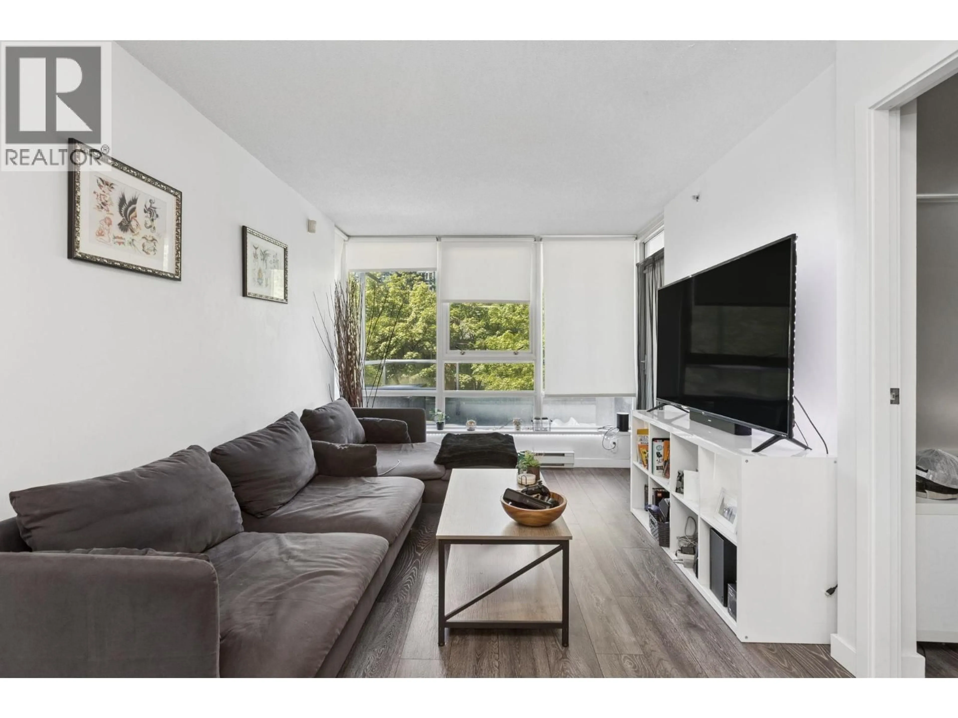 Living room with furniture, wood/laminate floor for 309 - 928 BEATTY STREET, Vancouver British Columbia V6Z3G6