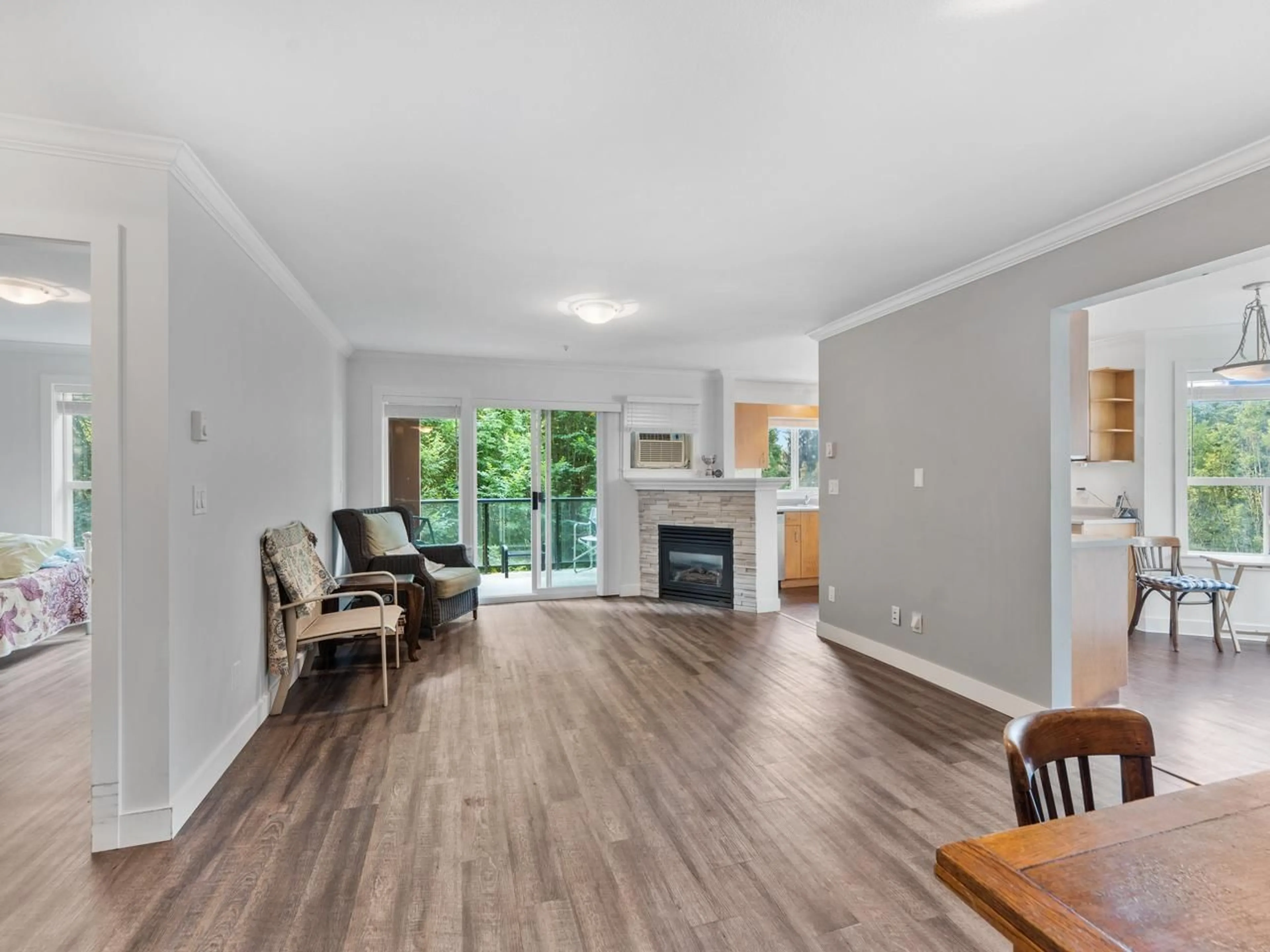 Living room with furniture, wood/laminate floor for 303 - 20239 MICHAUD CRESCENT, Langley British Columbia V3A8L1