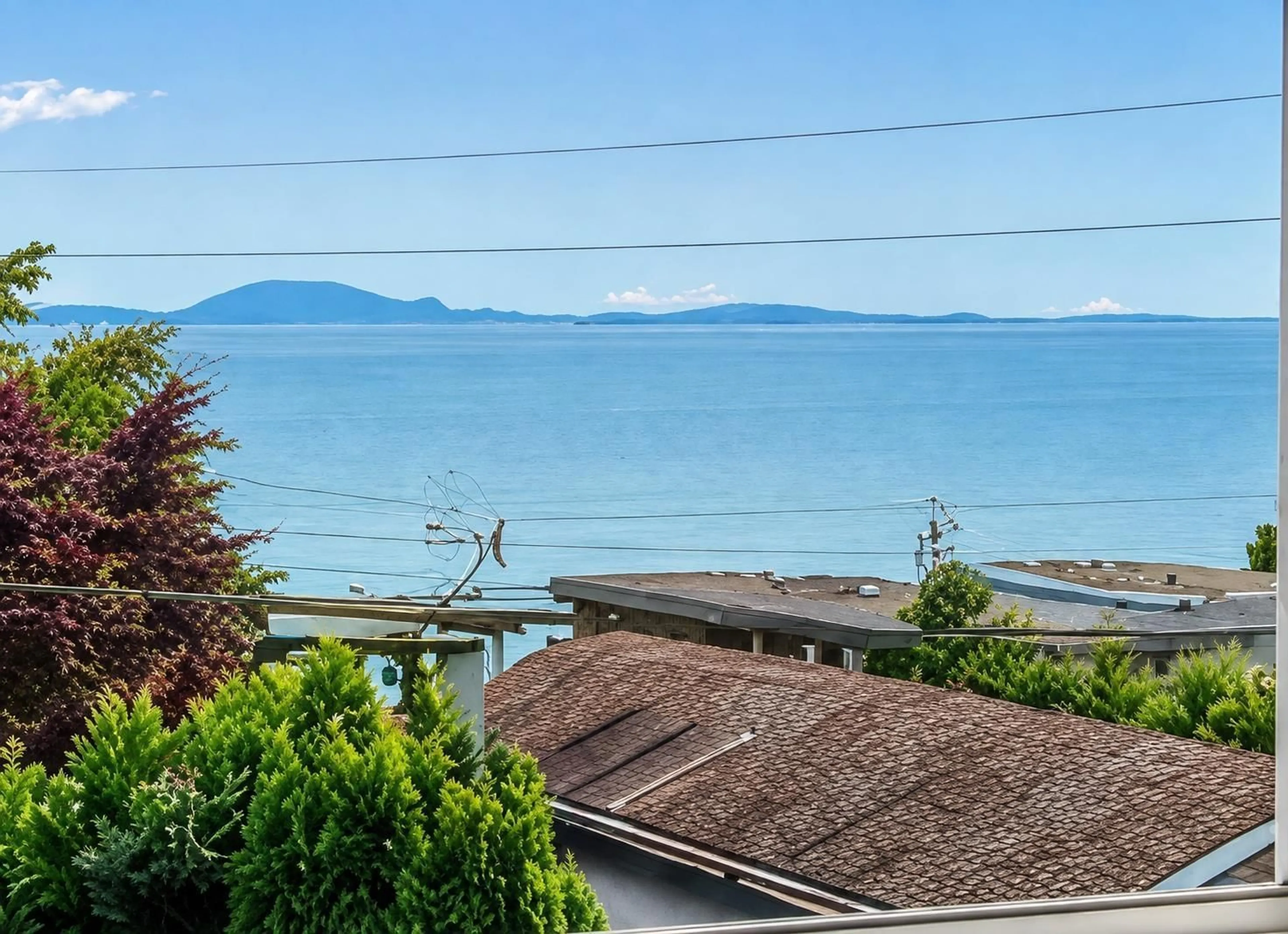 A pic from outside/outdoor area/front of a property/back of a property/a pic from drone, water/lake/river/ocean view for 204 - 15176 BUENA VISTA AVENUE, White Rock British Columbia V4B1Y3