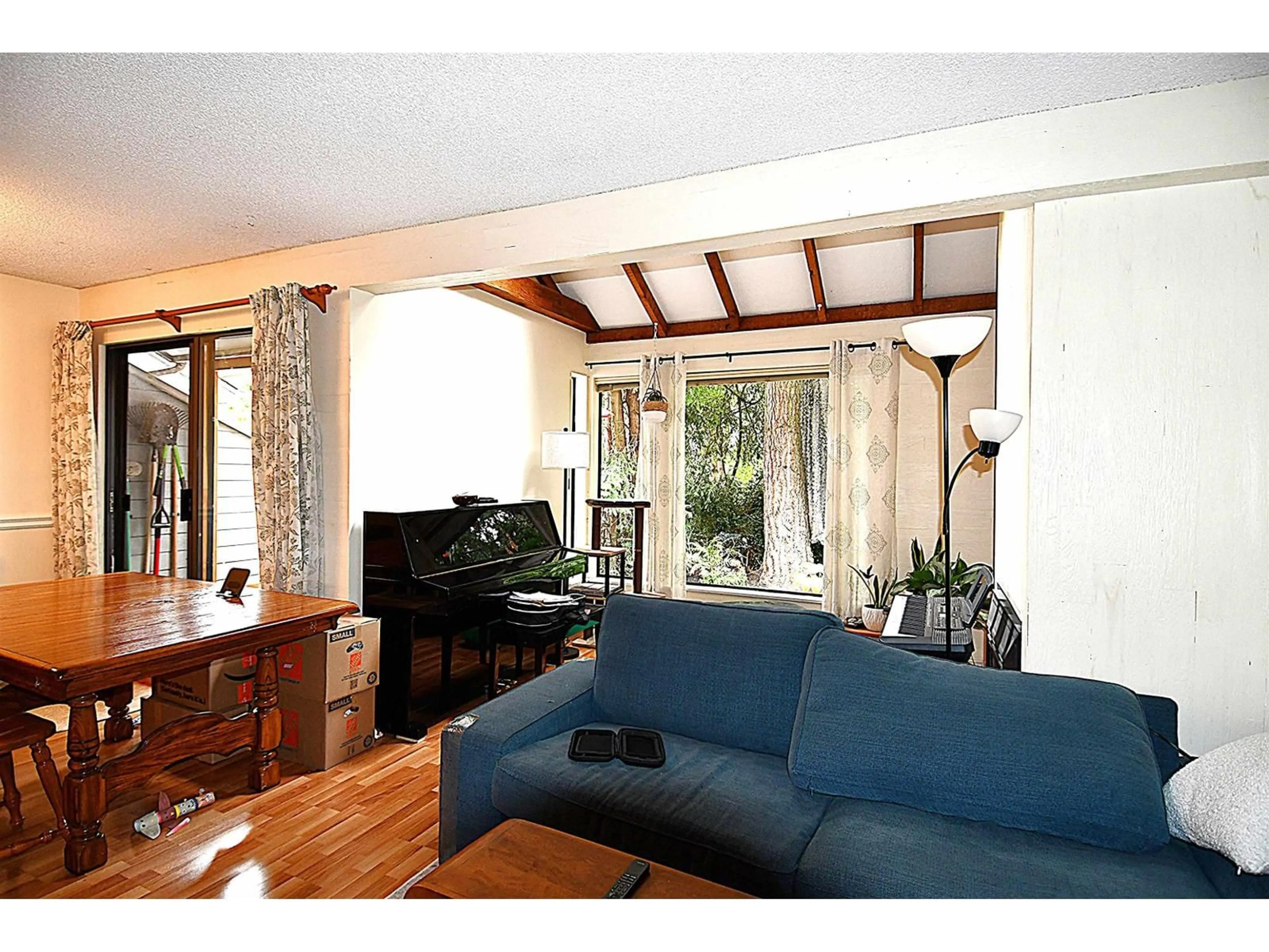 Living room with furniture, wood/laminate floor for 15855 ALDER PLACE, Surrey British Columbia V4A5J1