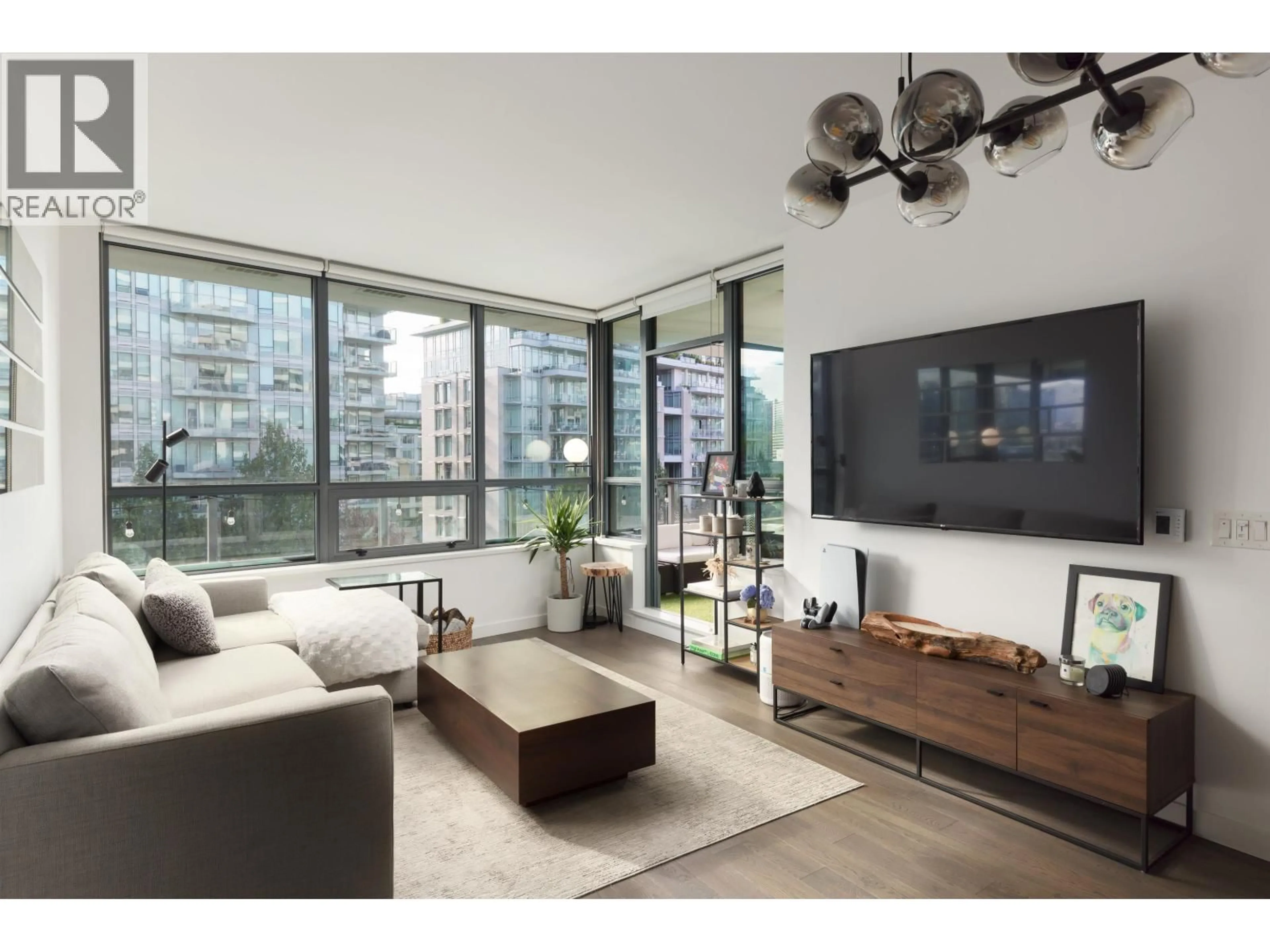 Living room with furniture, wood/laminate floor for 605 - 1688 PULLMAN PORTER STREET, Vancouver British Columbia V6A0H4