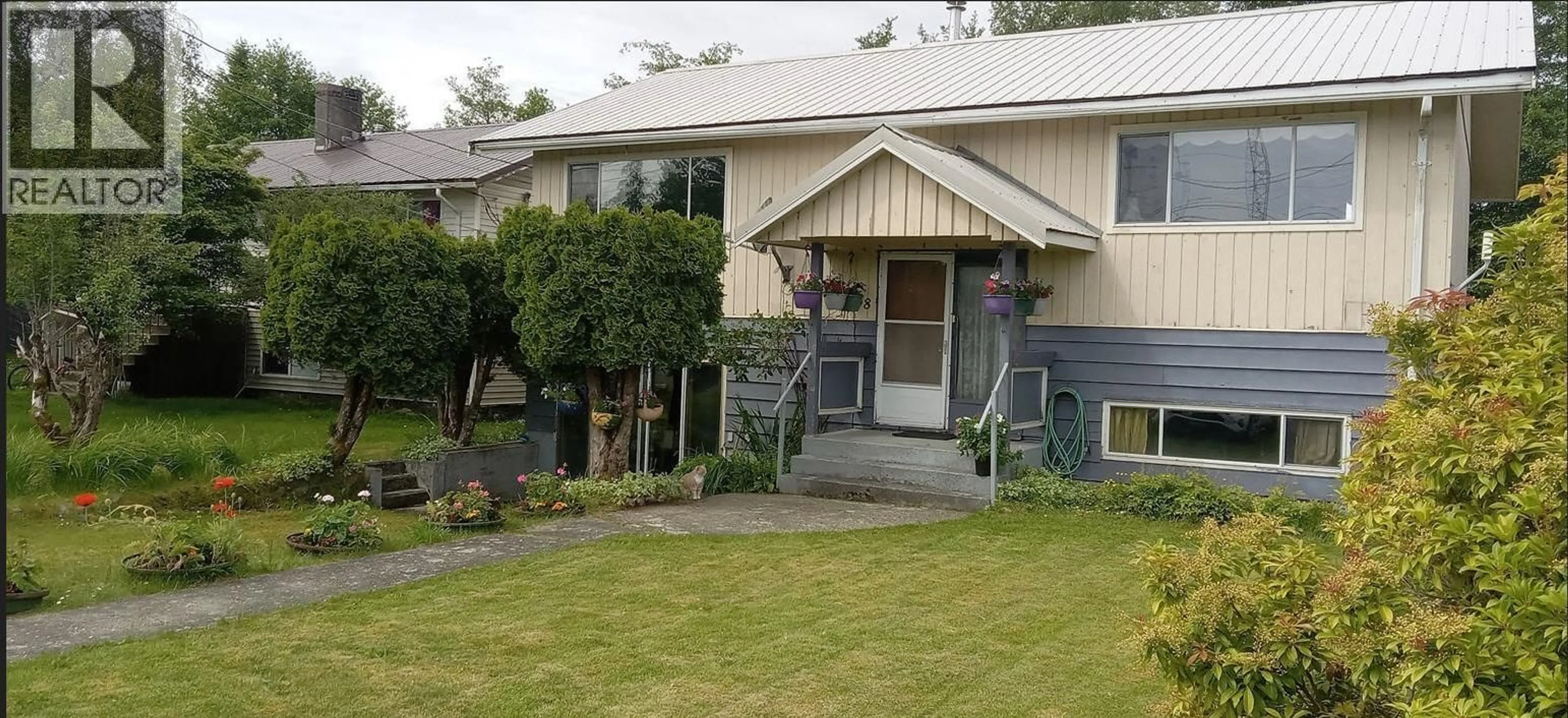 Home with vinyl exterior material, street for 38 TINGLEY STREET, Port Clements British Columbia V0T1R0
