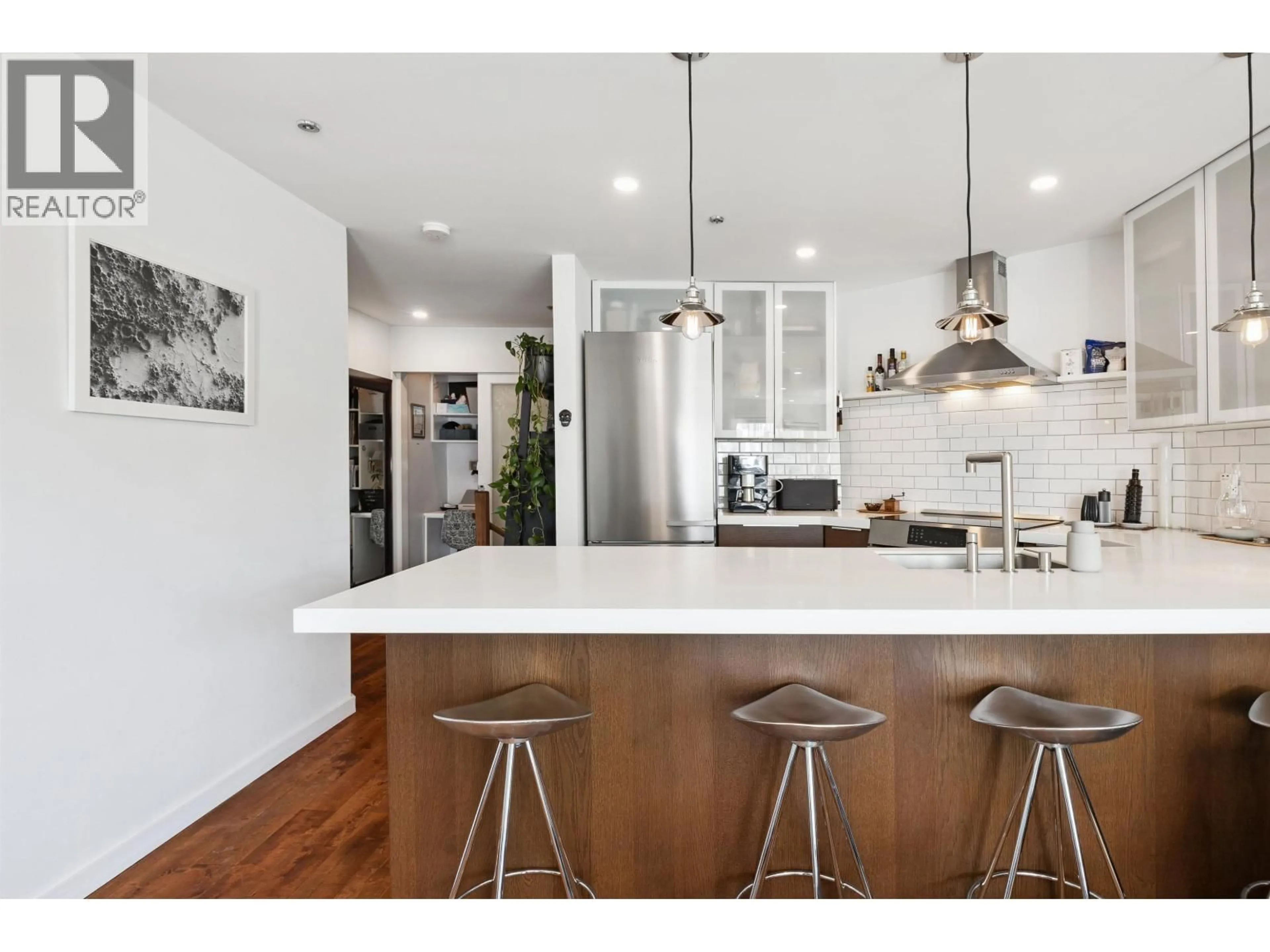 Open concept kitchen, wood/laminate floor for 105 - 953 8TH AVENUE, Vancouver British Columbia V5Z1E4