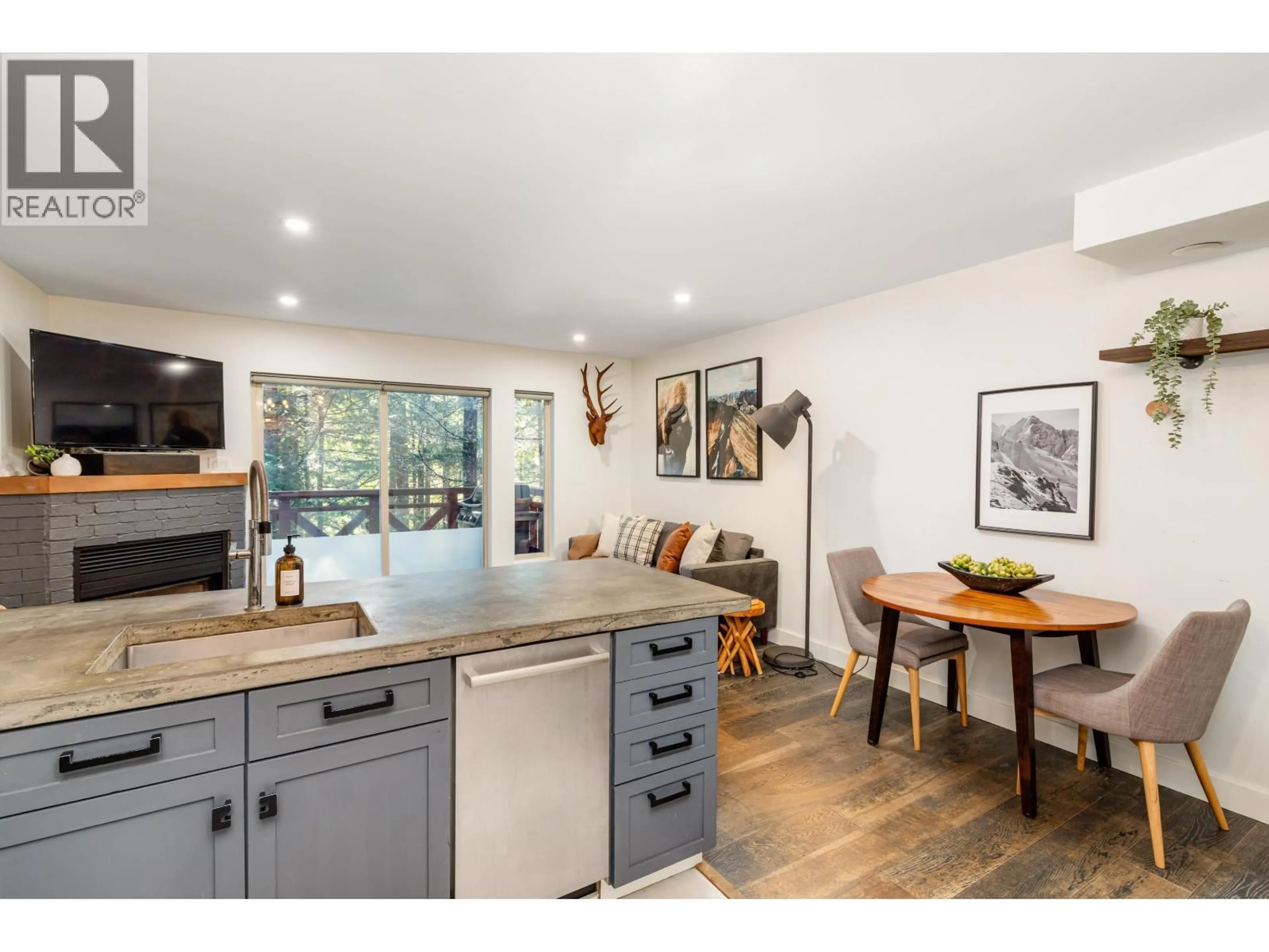 Open concept kitchen, wood/laminate floor for 113 - 3070 HILLCREST DRIVE, Whistler British Columbia V8E0V1