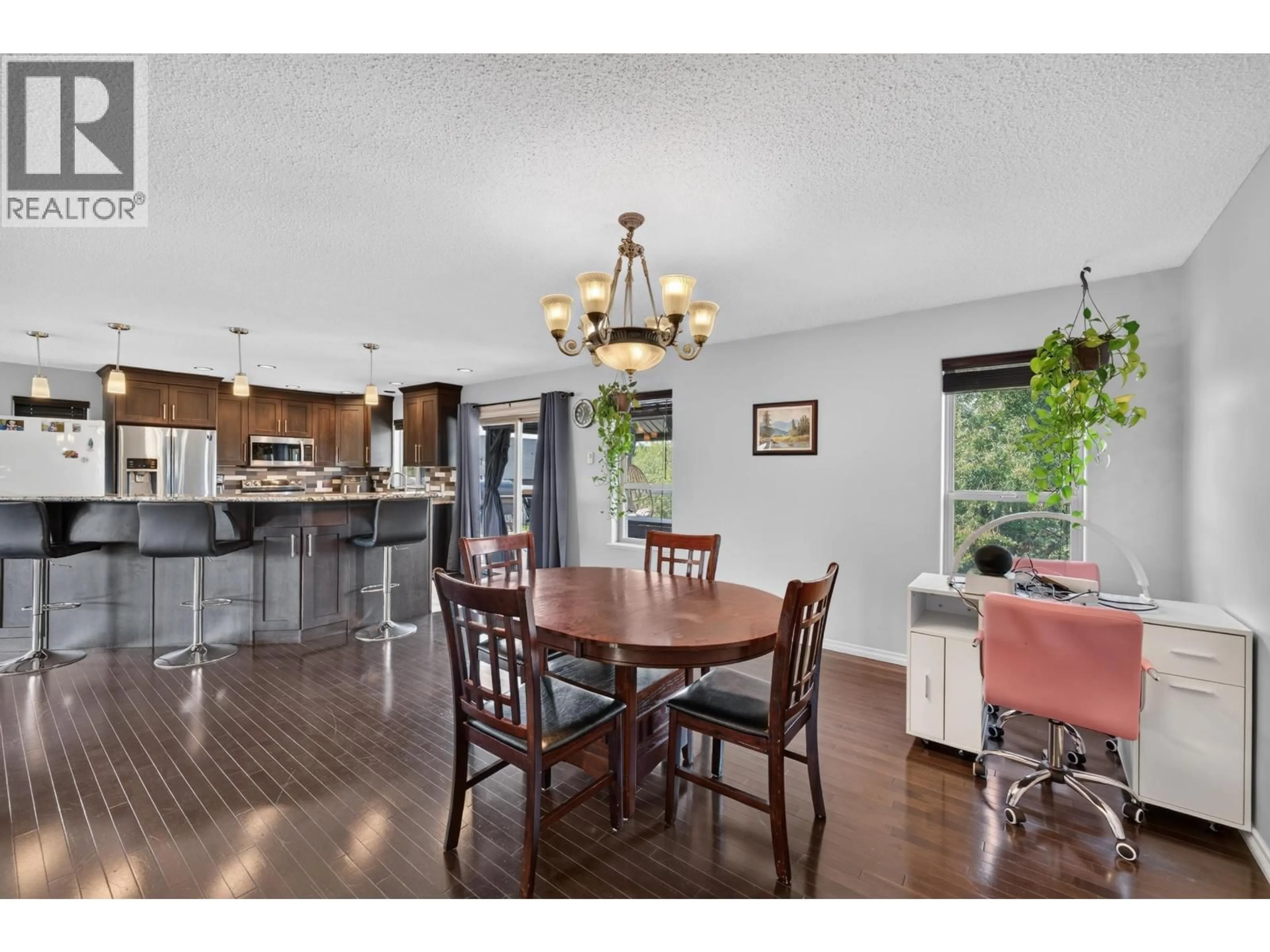 Open concept kitchen, wood/laminate floor for 11404 108 STREET, Fort St. John British Columbia V1J6Y2