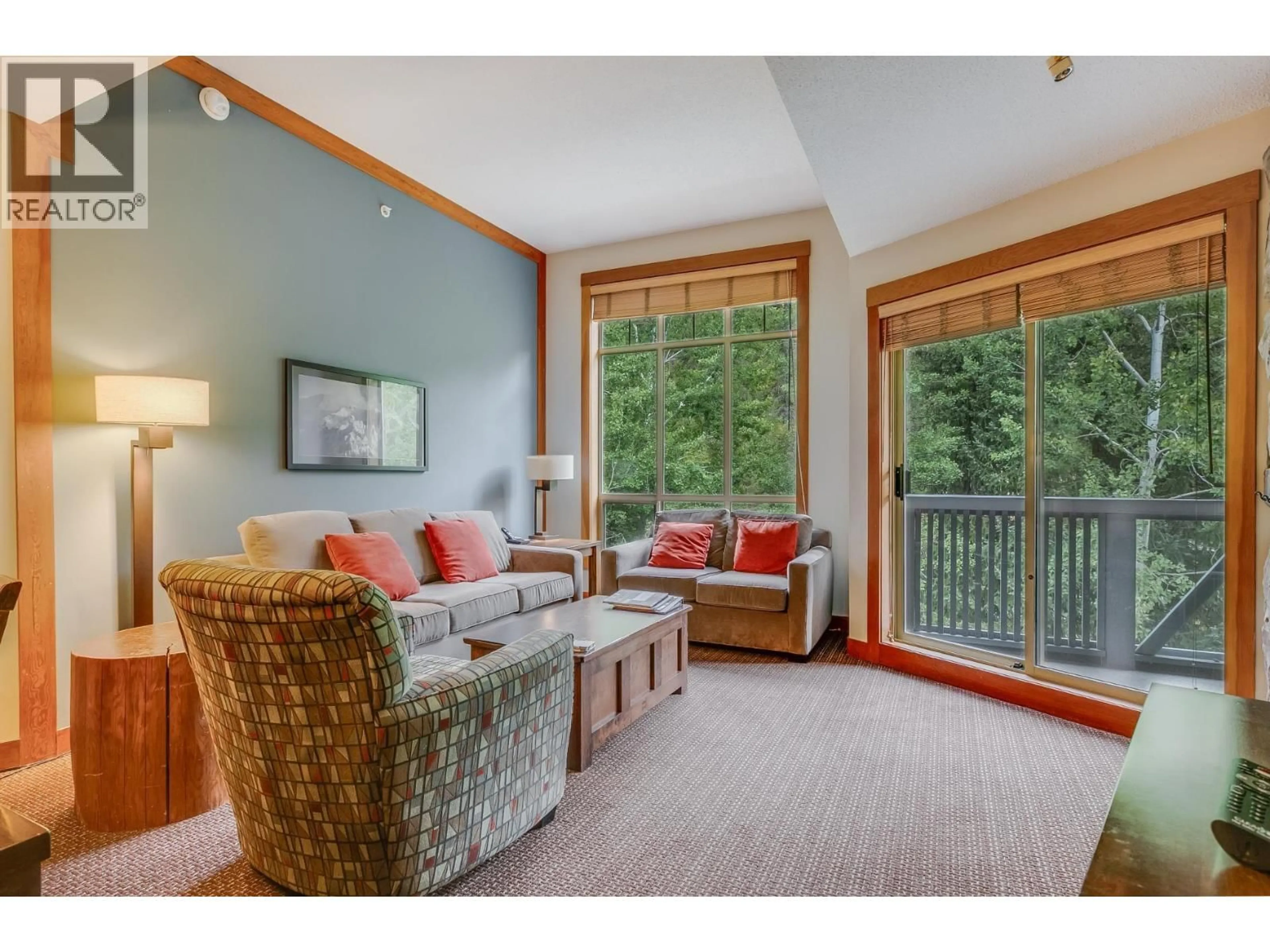 Living room with furniture, wood/laminate floor for 532D - 2036 LONDON LANE, Whistler British Columbia V8E0N7