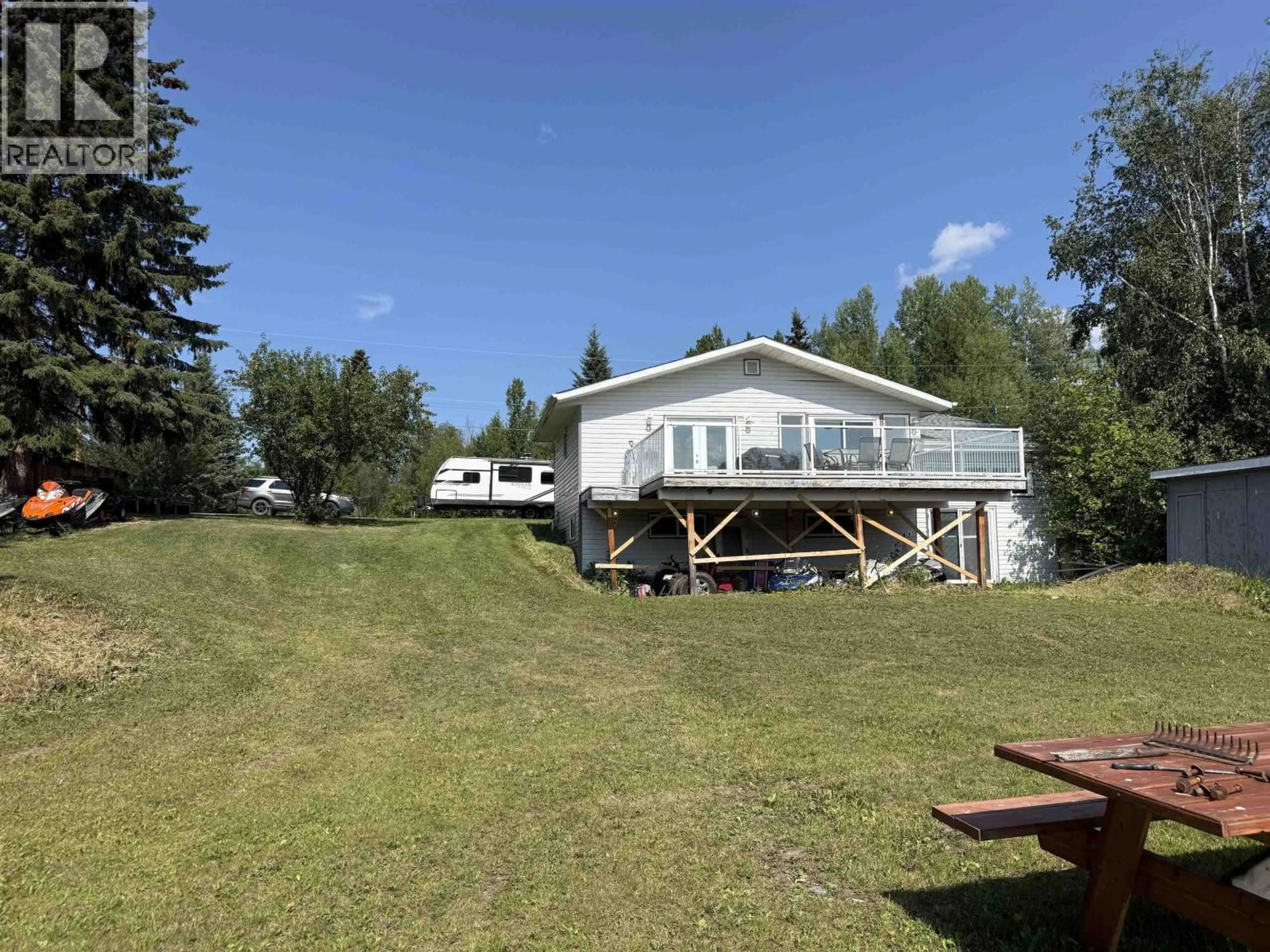 A pic from outside/outdoor area/front of a property/back of a property/a pic from drone, water/lake/river/ocean view for 2055 GEROW ISLAND ROAD, Burns Lake British Columbia V0J1E2