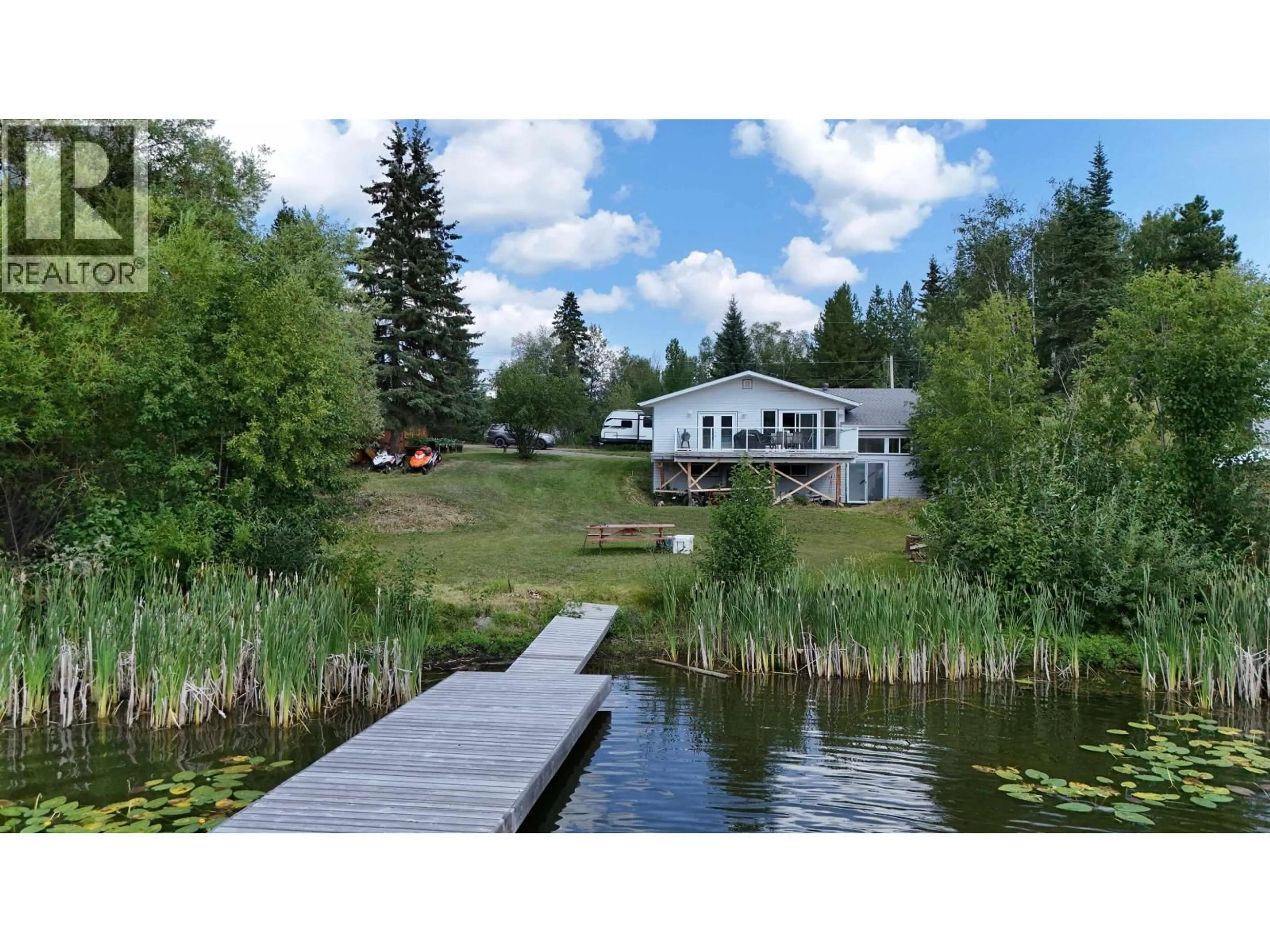 A pic from outside/outdoor area/front of a property/back of a property/a pic from drone, water/lake/river/ocean view for 2055 GEROW ISLAND ROAD, Burns Lake British Columbia V0J1E2