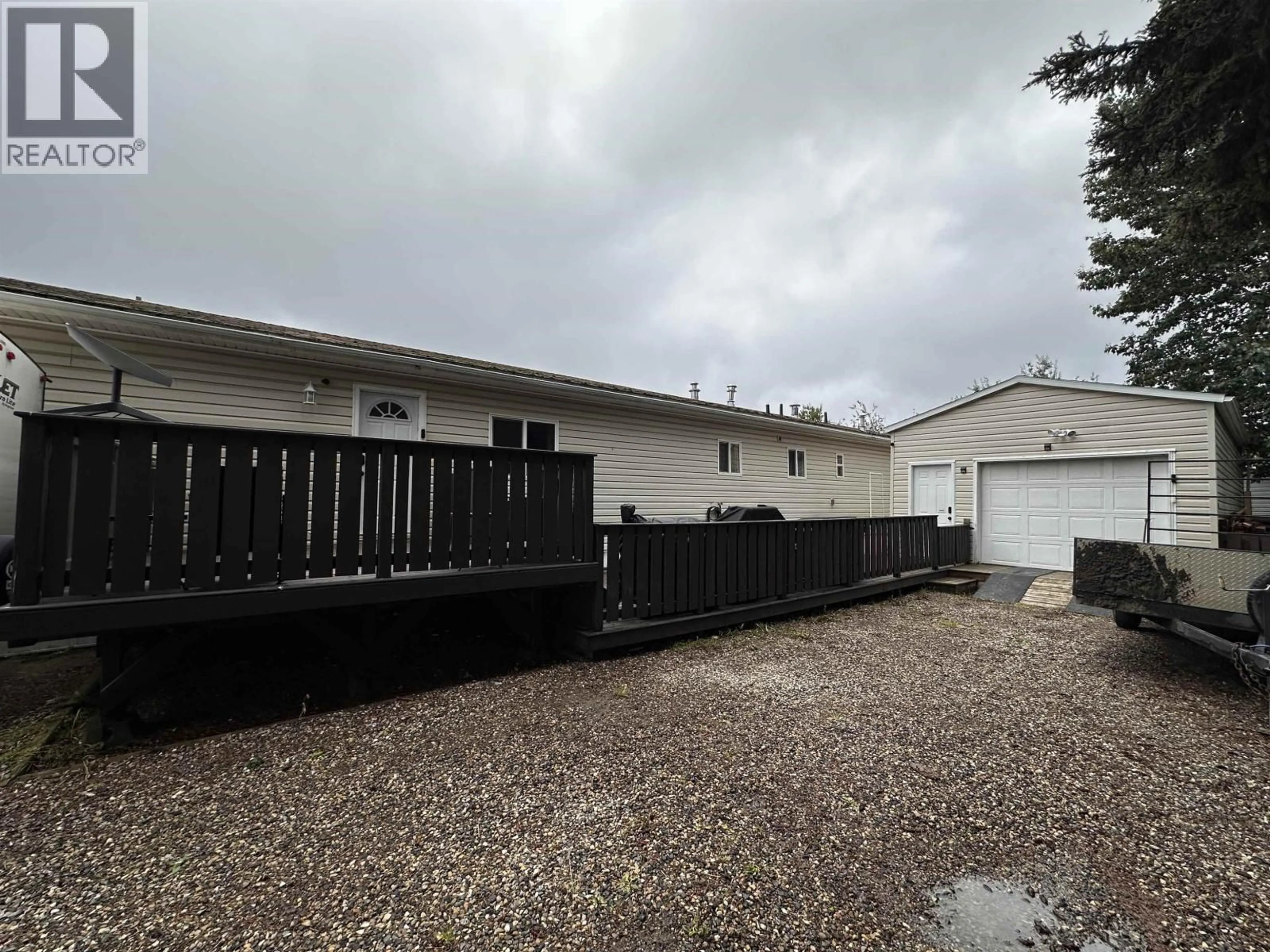A pic from outside/outdoor area/front of a property/back of a property/a pic from drone, street for 4107 53 AVENUE, Fort Nelson British Columbia V0C1R0