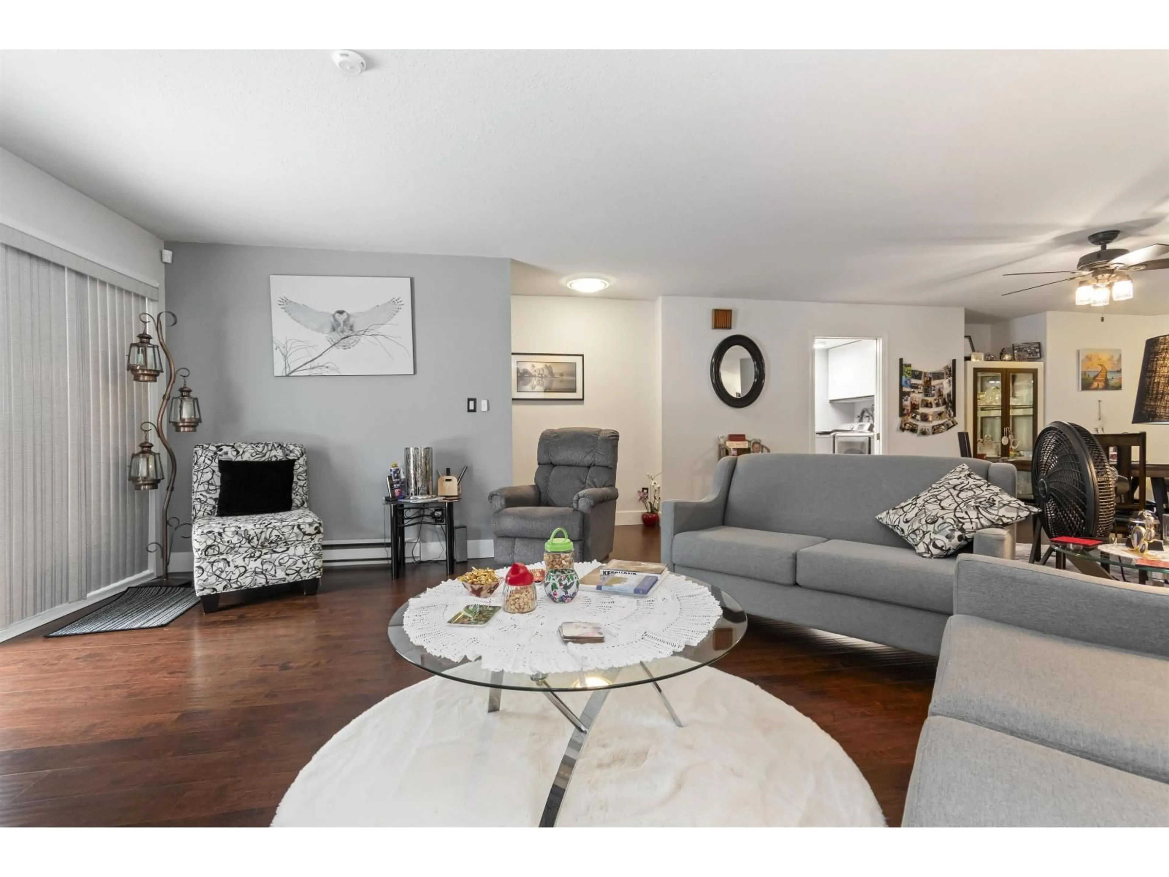 Living room with furniture, wood/laminate floor for 407 - 19645 64 AVENUE, Langley British Columbia V2Y1L2