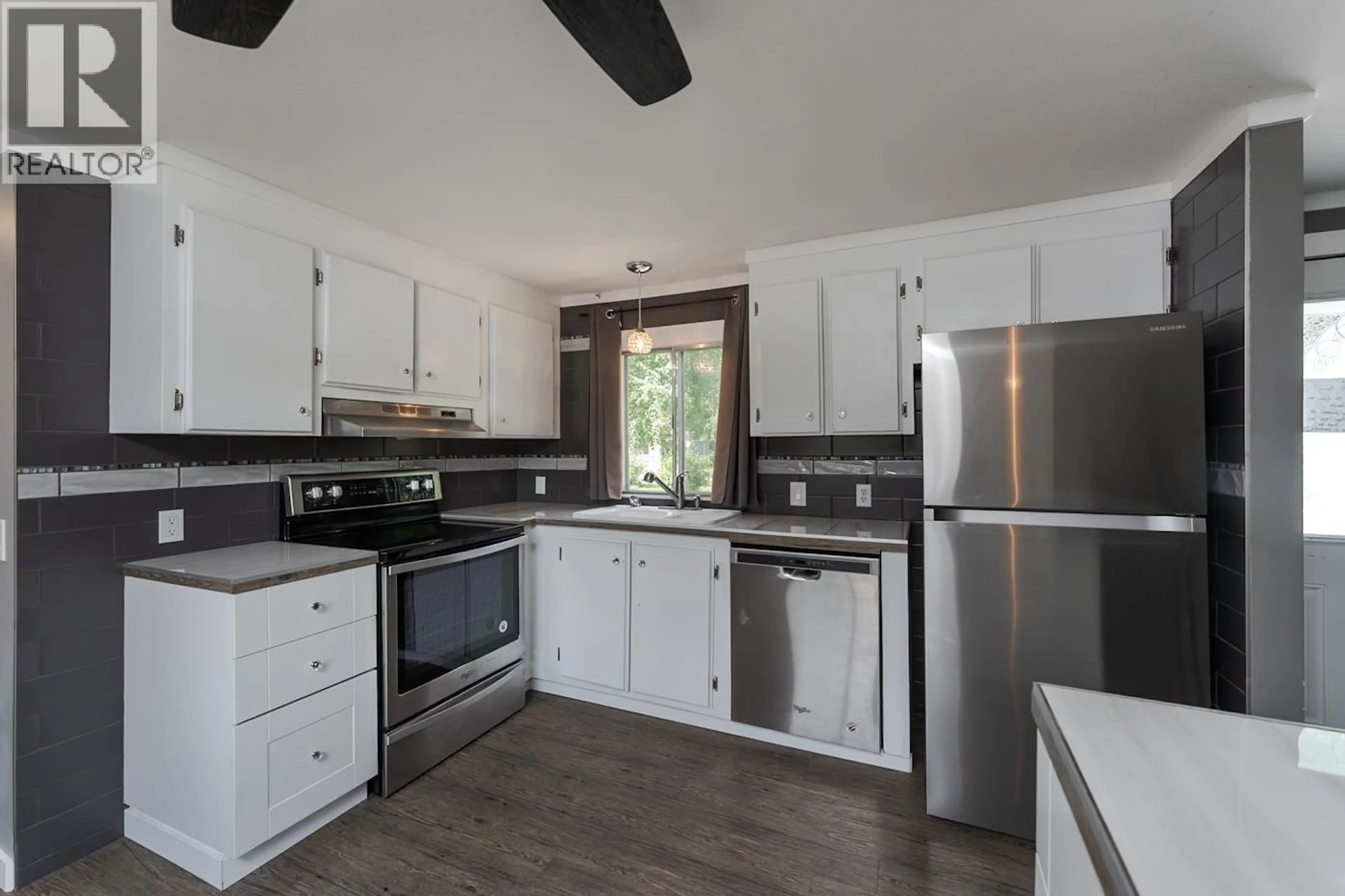 Open concept kitchen, wood/laminate floor for 30 - 6100 DAKELH, Prince George British Columbia V2N4R1