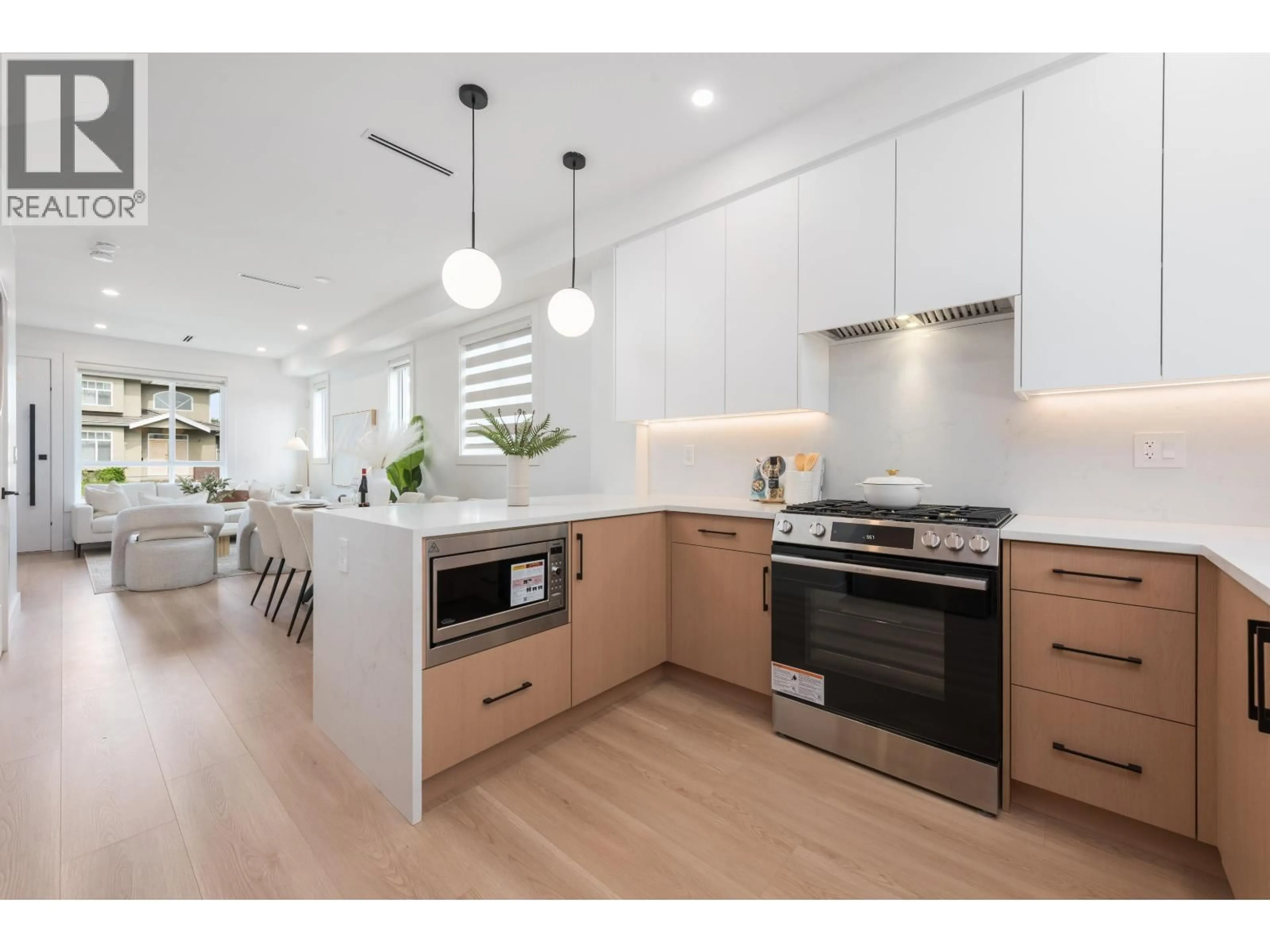Open concept kitchen, wood/laminate floor for 5 - 6808 ELWELL STREET, Burnaby British Columbia V5E1K1