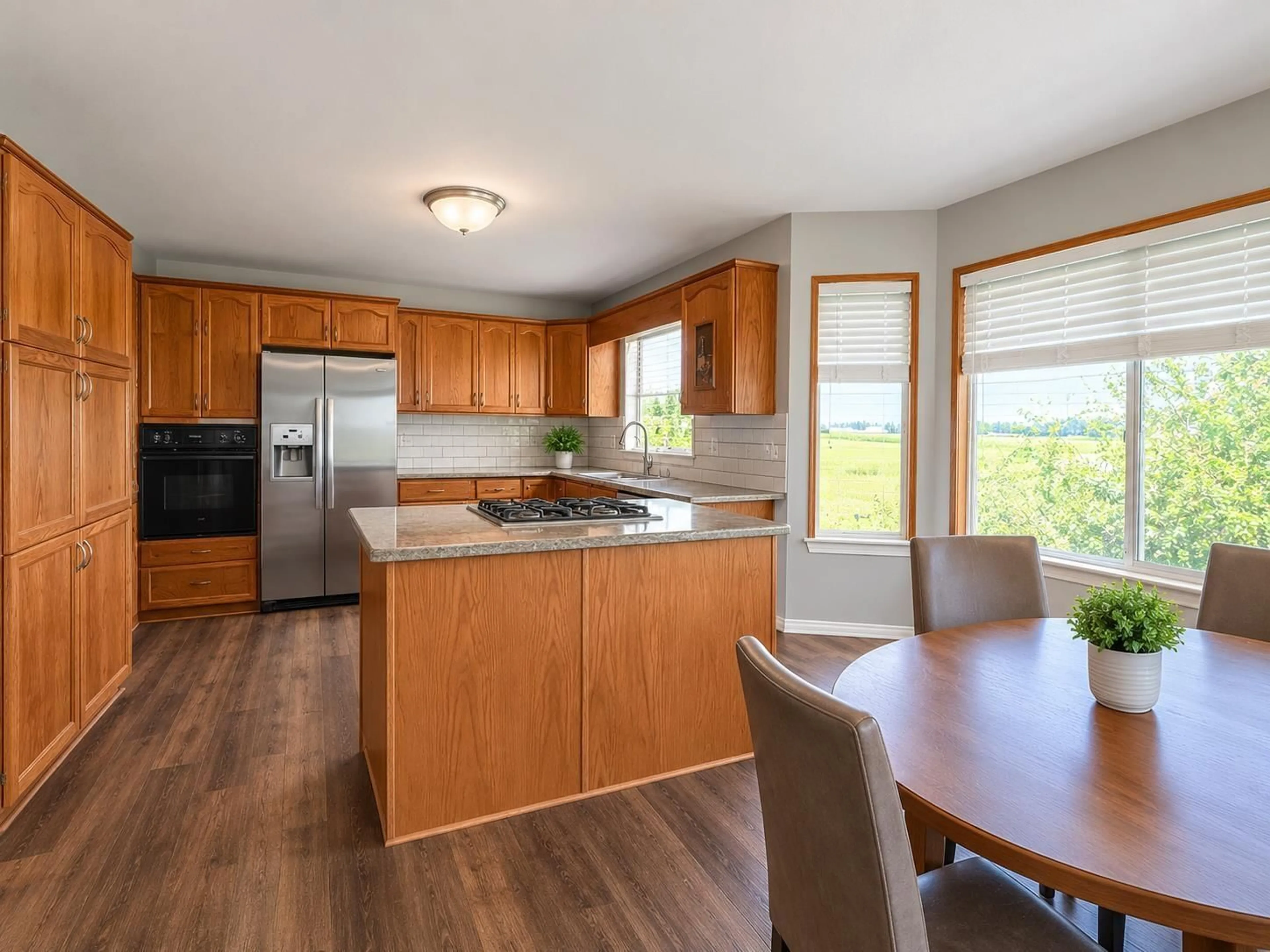 Open concept kitchen, wood/laminate floor for 8309 THOMPSON ROAD, Mission British Columbia V0M1G0