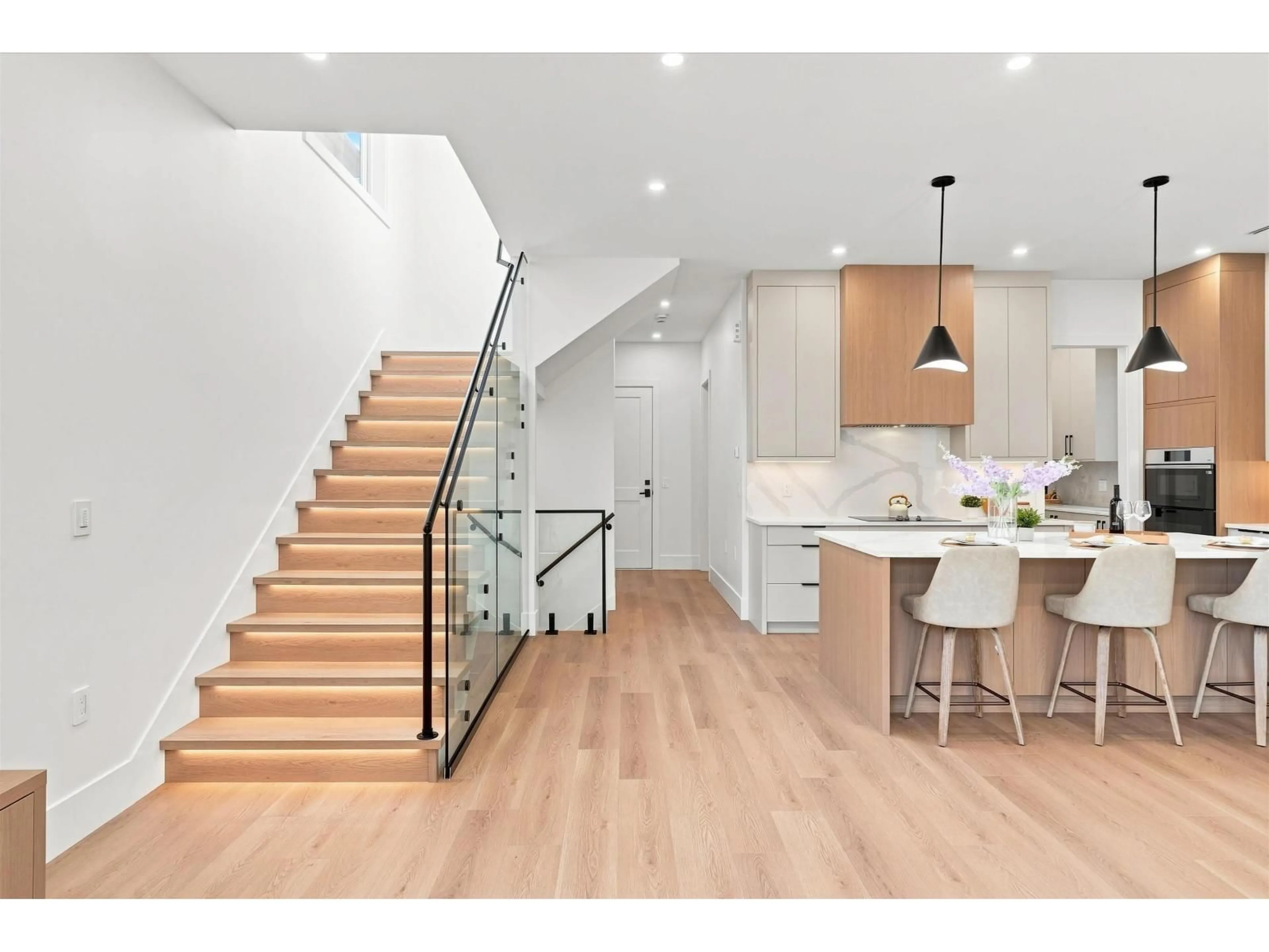 Open concept kitchen, wood/laminate floor for 11772 92 AVENUE, Delta British Columbia V4C3L4