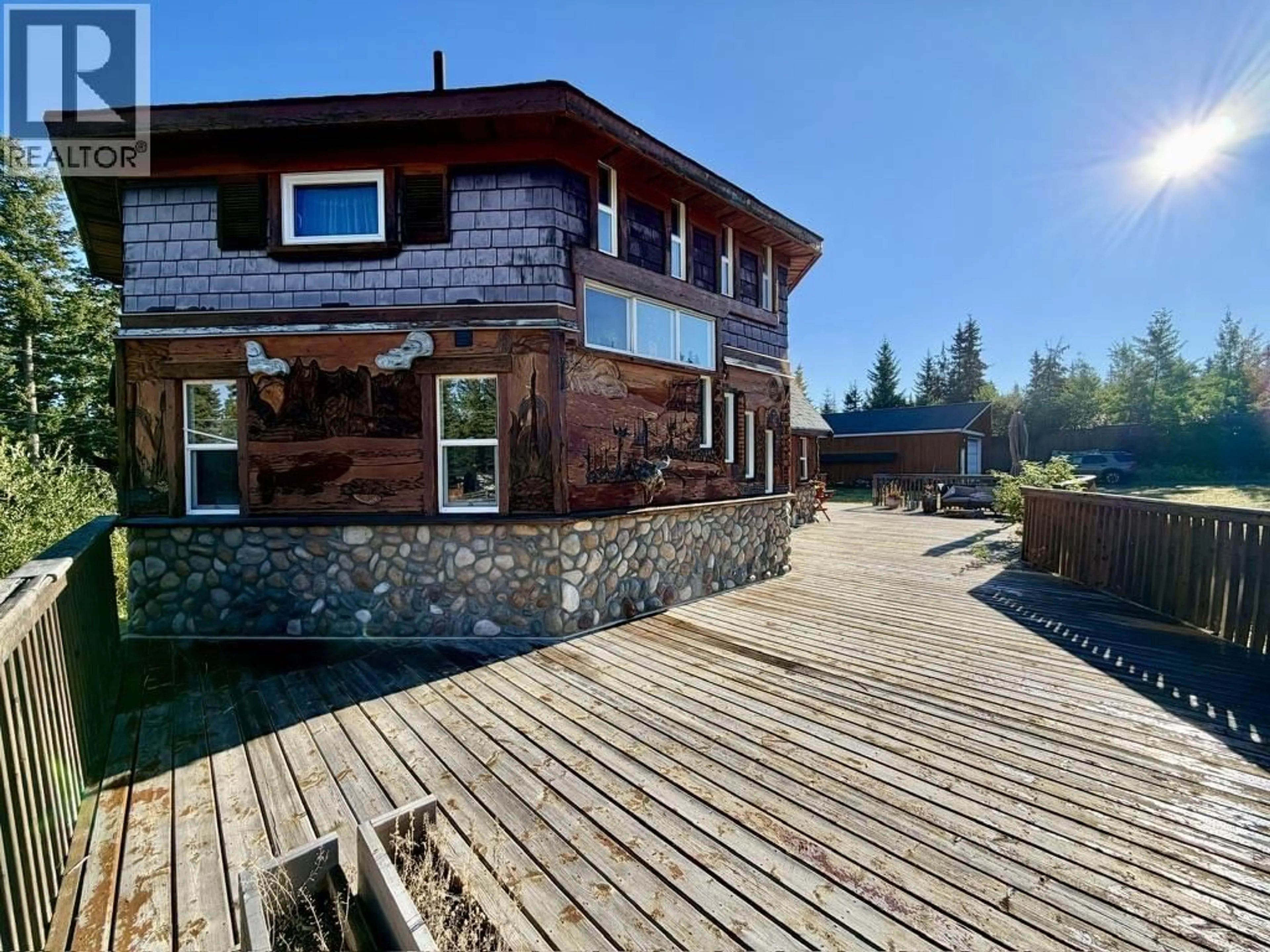 A pic from outside/outdoor area/front of a property/back of a property/a pic from drone, water/lake/river/ocean view for 7574 WOMACK ROAD, Deka Lake / Sulphurous / Hathaway Lakes British Columbia V0K1X3