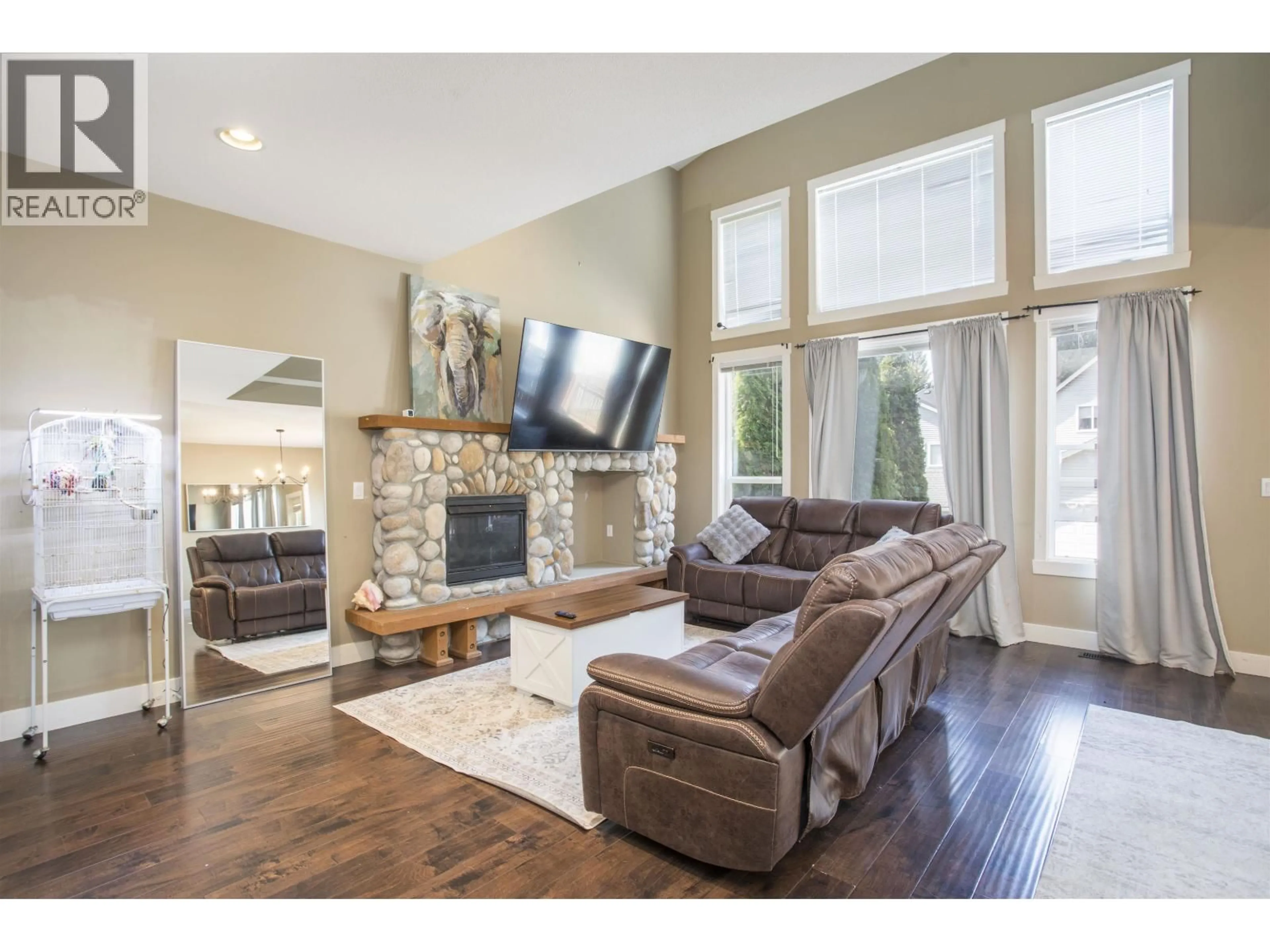 Living room with furniture, wood/laminate floor for 10337 243A STREET, Maple Ridge British Columbia V2W2C7