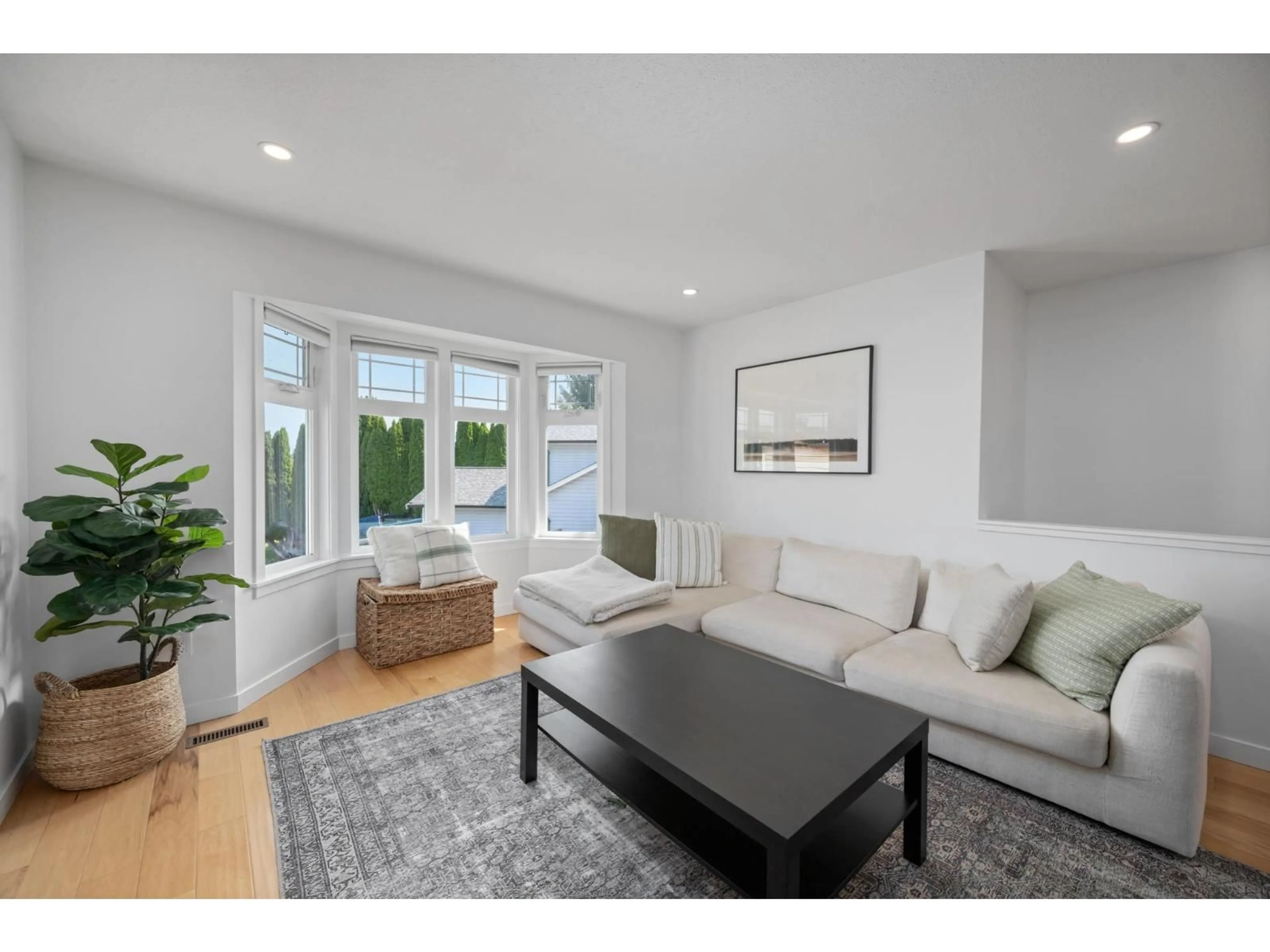 Living room with furniture, wood/laminate floor for 26526 30 AVENUE, Langley British Columbia V4W3B7