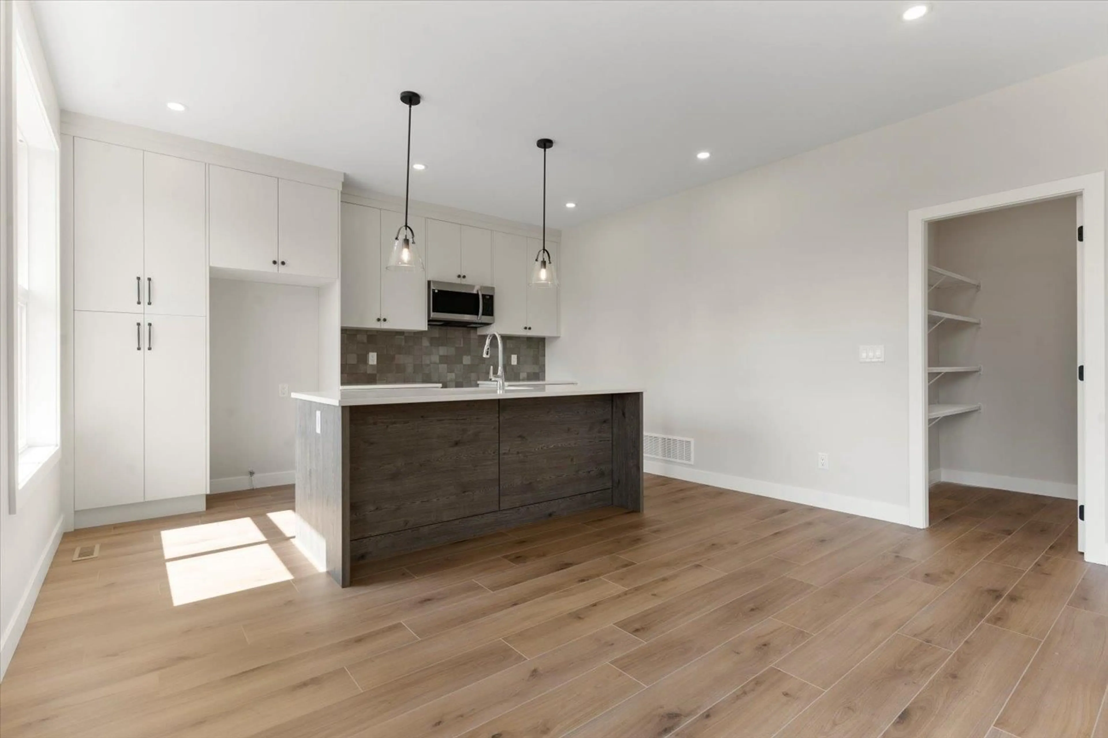 Open concept kitchen, wood/laminate floor for 1 - 46058 BONNY AVENUE, Chilliwack British Columbia V2P3H6
