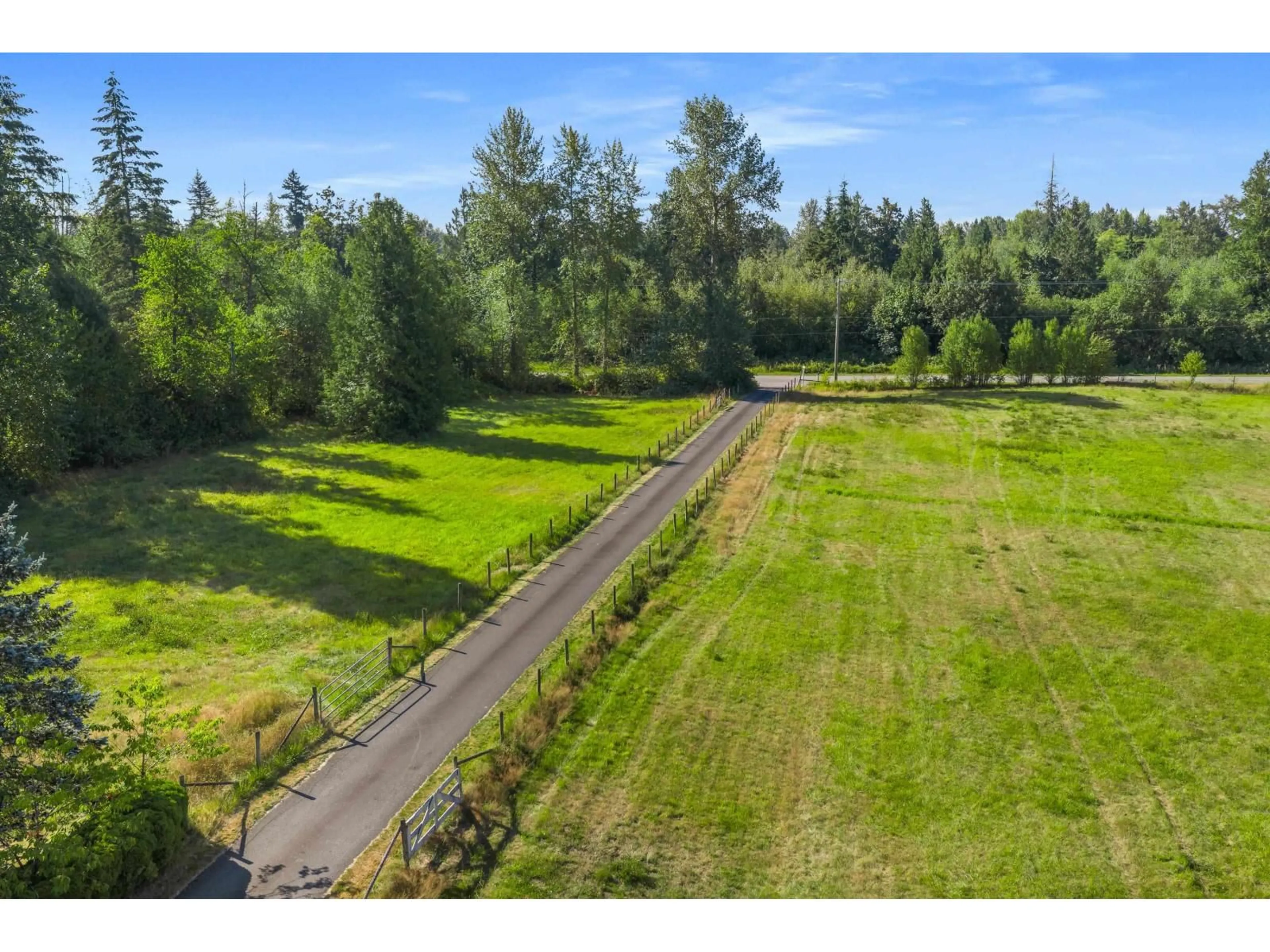 A pic from outside/outdoor area/front of a property/back of a property/a pic from drone, forest/trees view for 22155 0 AVENUE, Langley British Columbia V2Z1S1