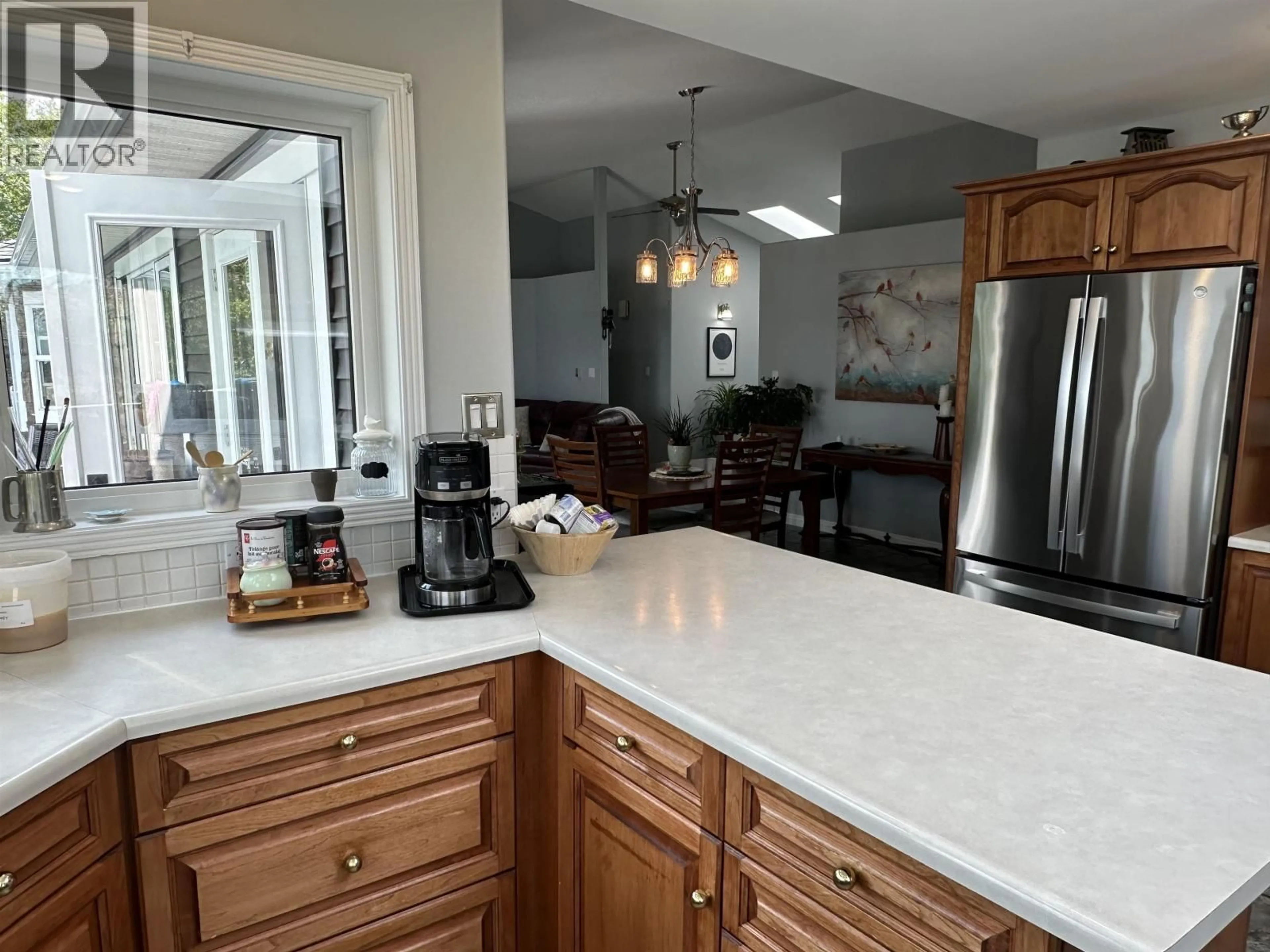 Open concept kitchen, ceramic/tile floor for 13345 CHARLIE LAKE CRESCENT, Charlie Lake British Columbia V0C1H0