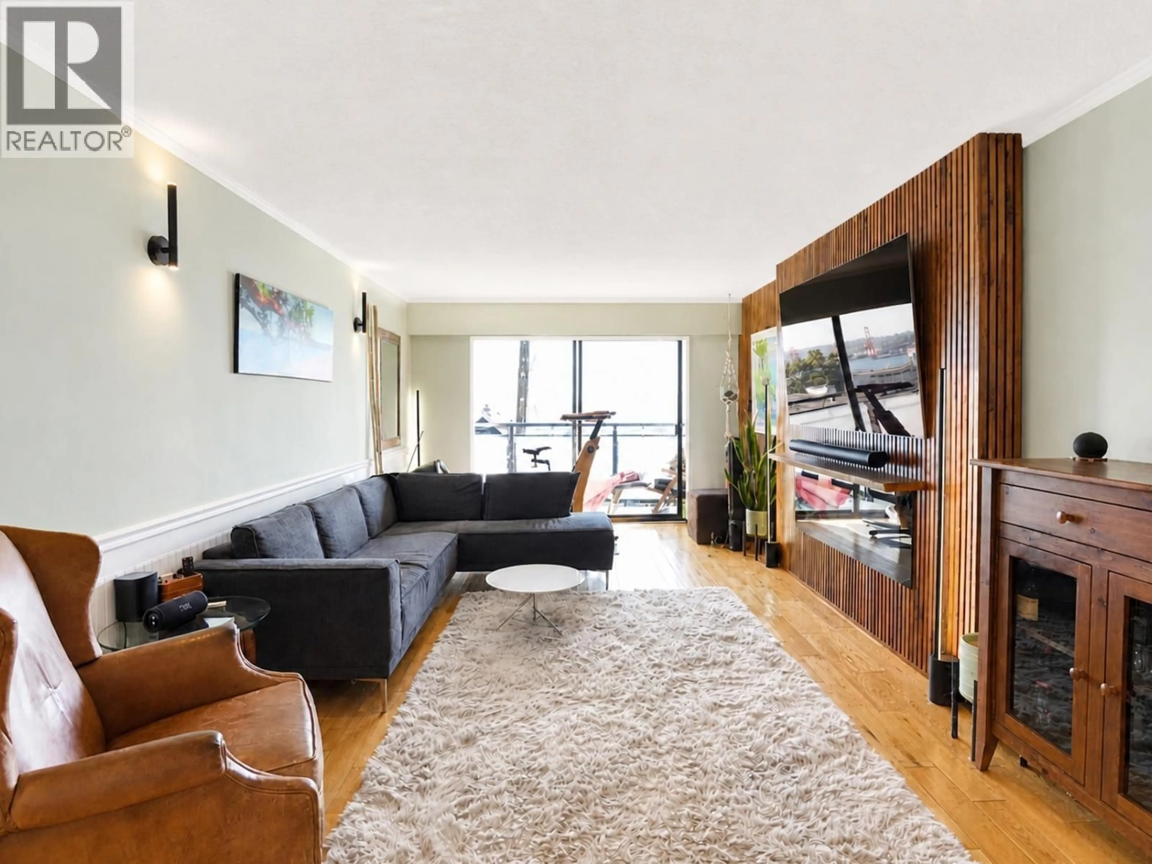 Living room with furniture, wood/laminate floor for 303 - 441 3RD STREET, North Vancouver British Columbia V7L1G3