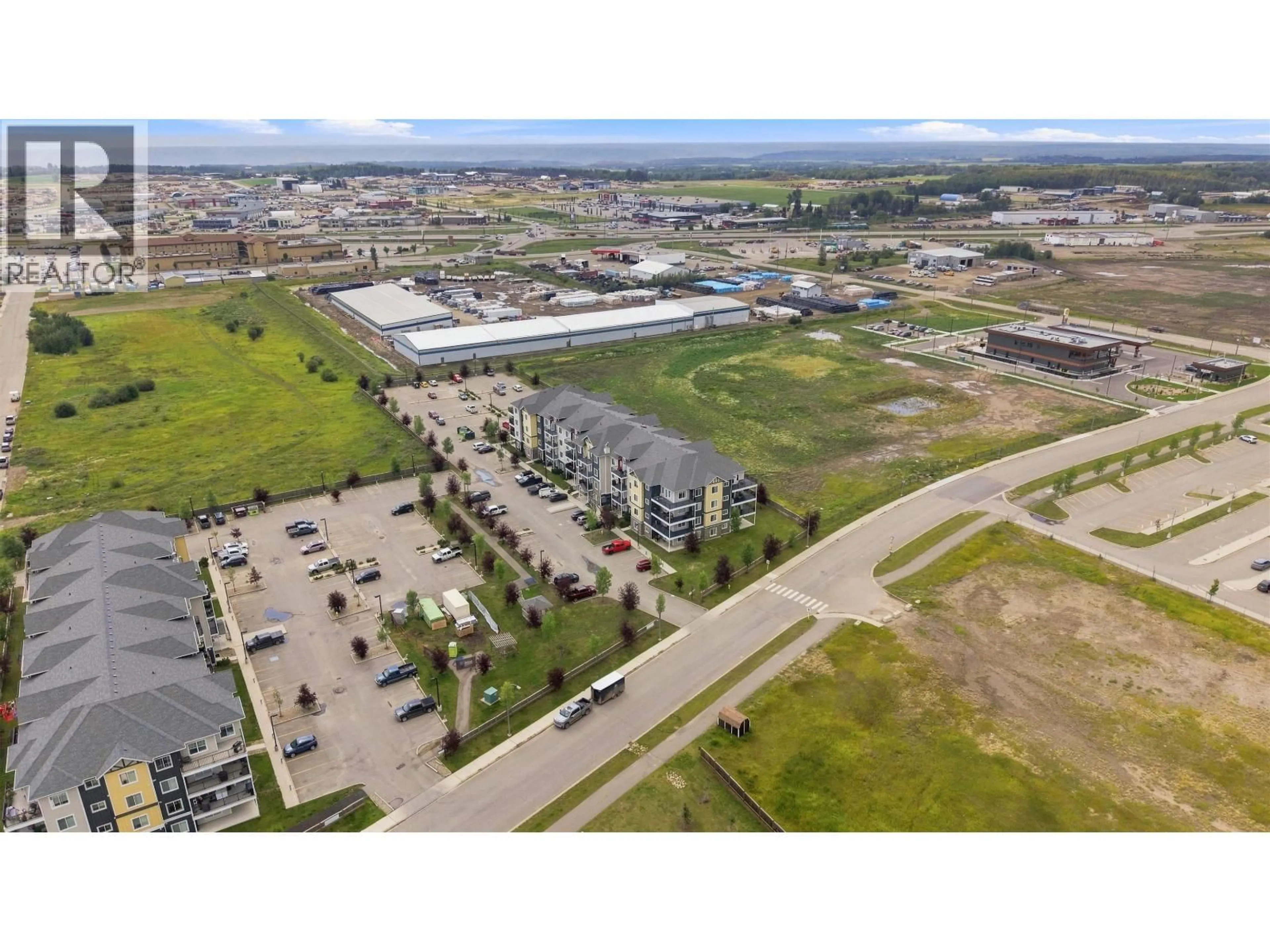 A pic from outside/outdoor area/front of a property/back of a property/a pic from drone, unknown for 108 - 11205 105 AVENUE, Fort St. John British Columbia V1J0L3