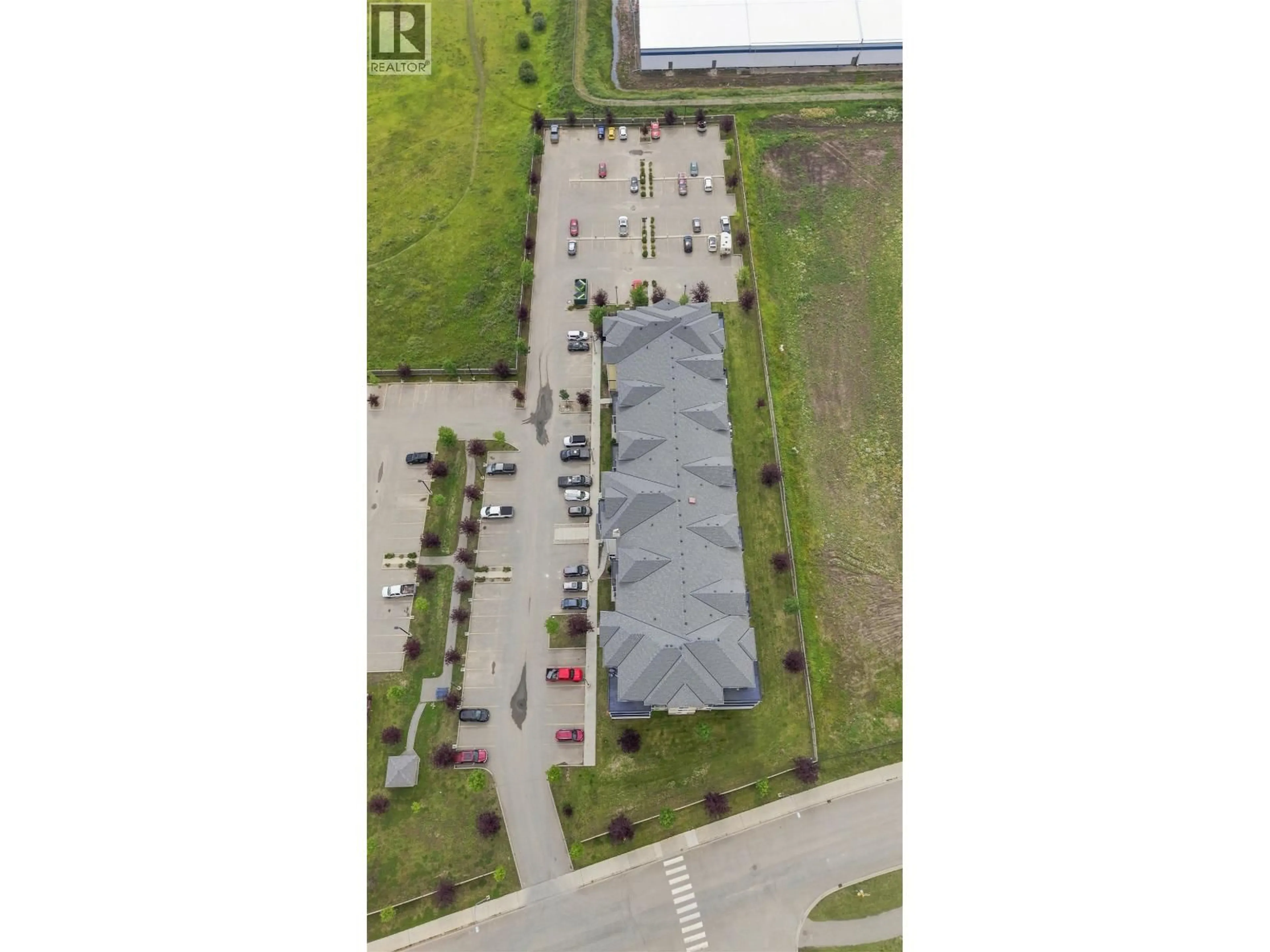 A pic from outside/outdoor area/front of a property/back of a property/a pic from drone, street for 108 - 11205 105 AVENUE, Fort St. John British Columbia V1J0L3