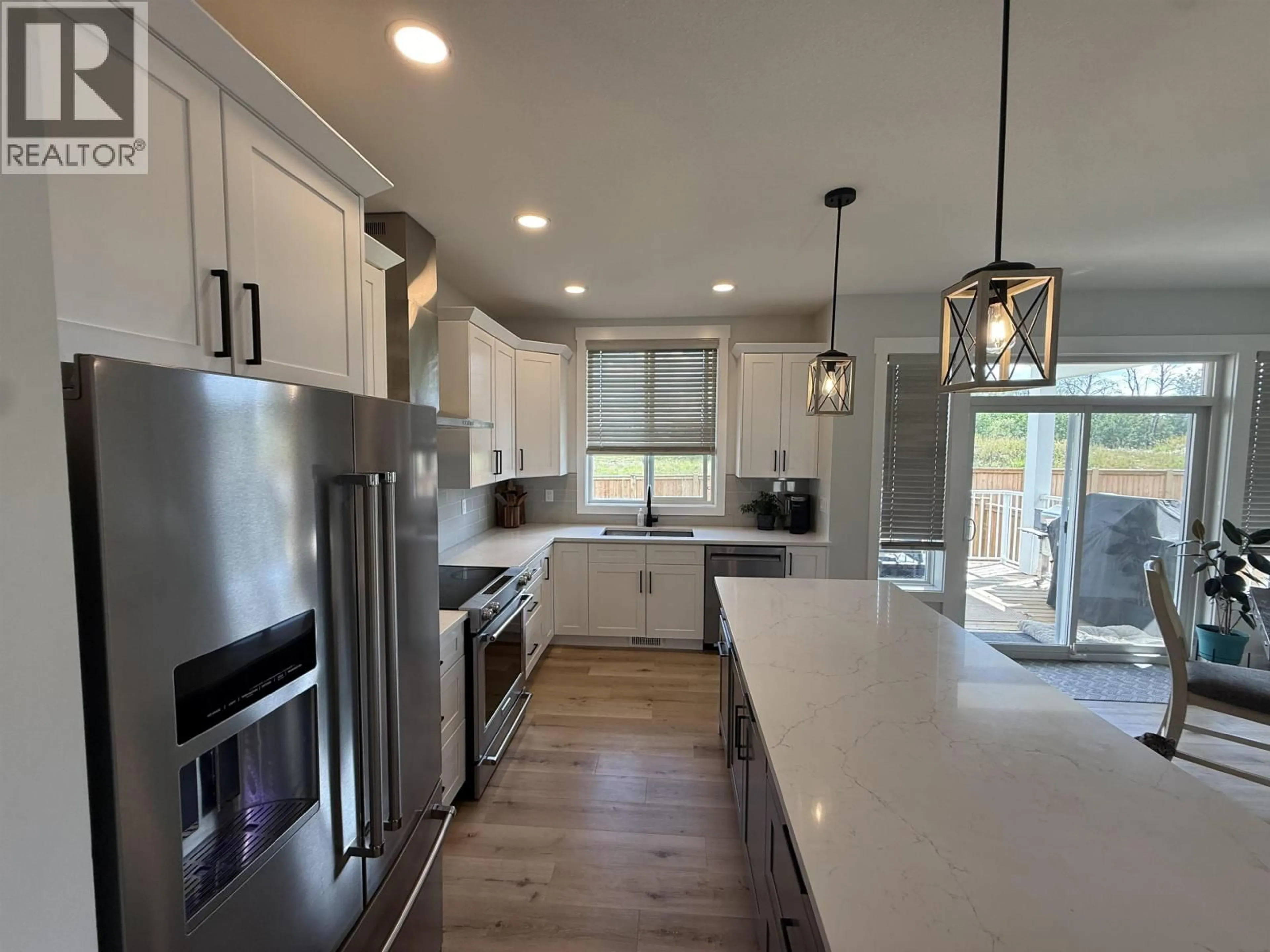 Open concept kitchen, unknown for 10519 118 AVENUE, Fort St. John British Columbia V1J0M8