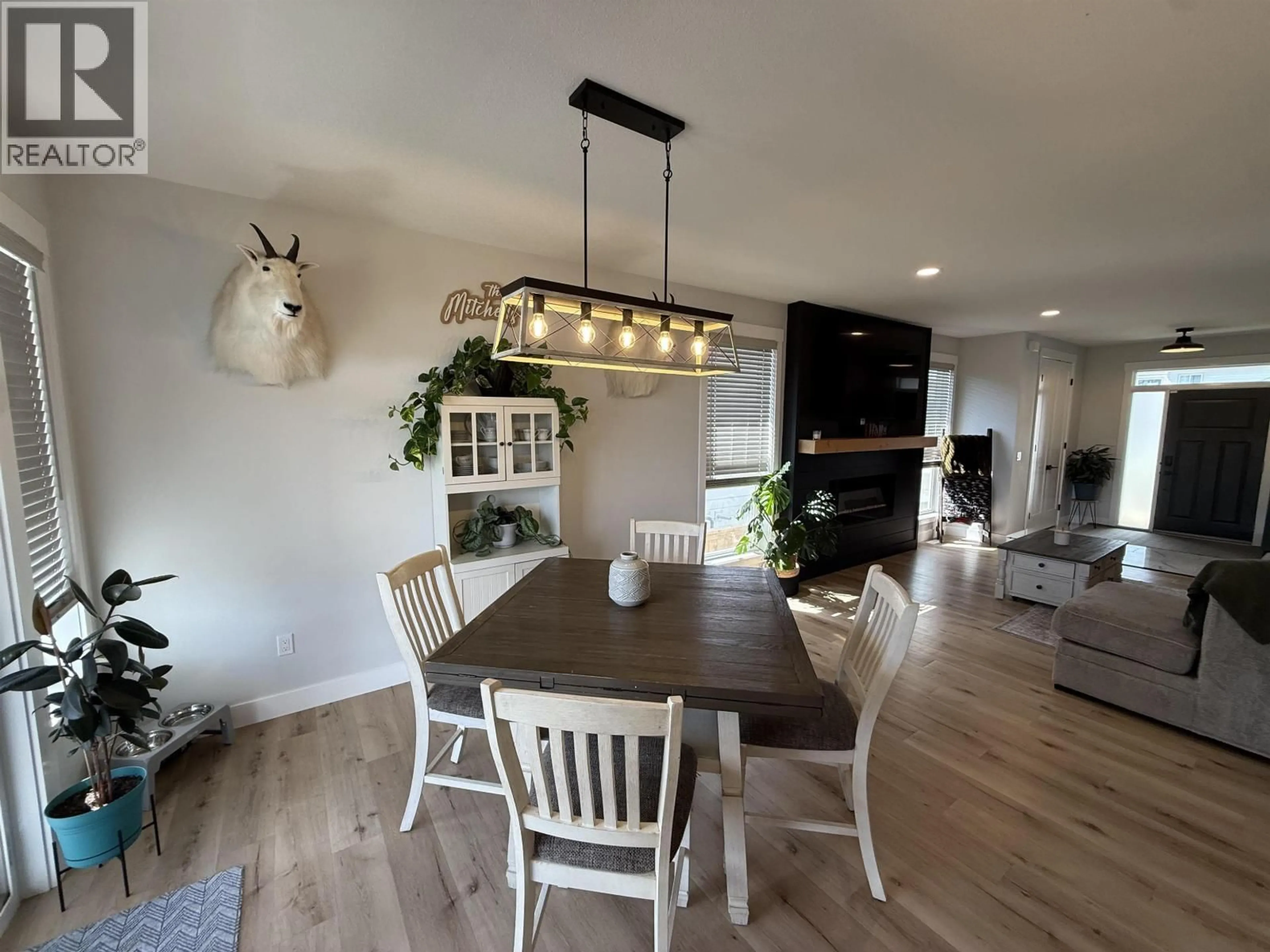 Open concept kitchen, wood/laminate floor for 10519 118 AVENUE, Fort St. John British Columbia V1J0M8
