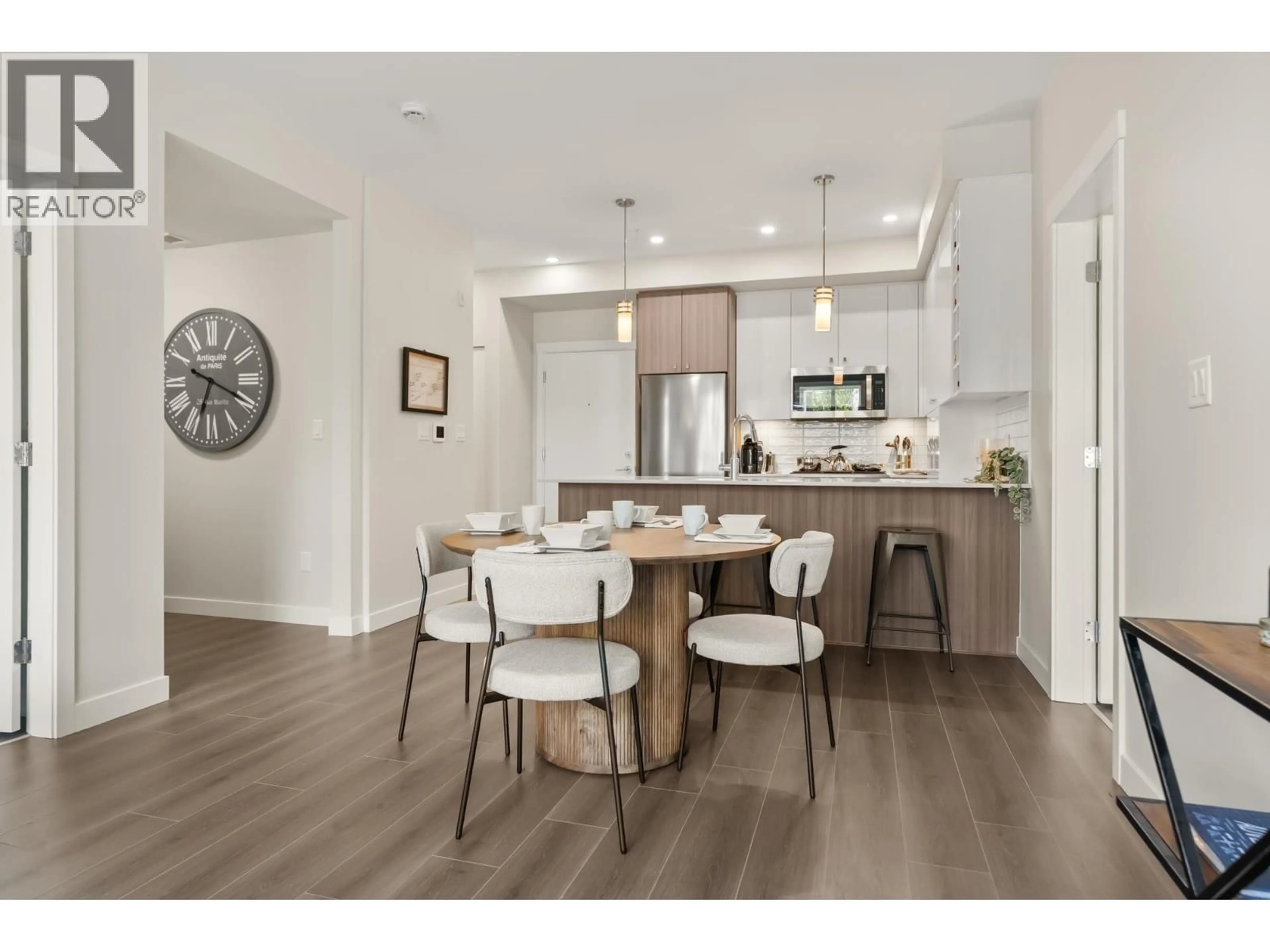 Open concept kitchen, wood/laminate floor for 207 - 23222 GILLEY ROAD, Richmond British Columbia V6V0C8