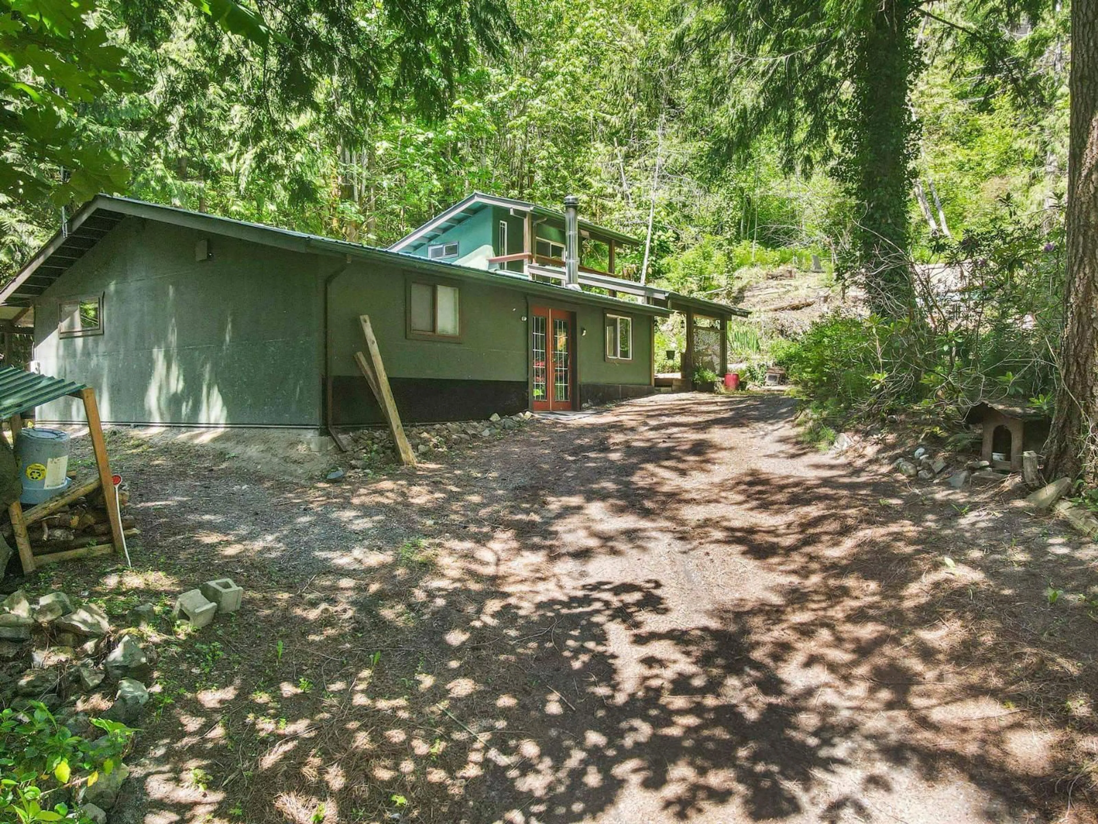 A pic from outside/outdoor area/front of a property/back of a property/a pic from drone, forest/trees view for 4139 SLESSE ROAD, Chilliwack British Columbia V4Z1B3