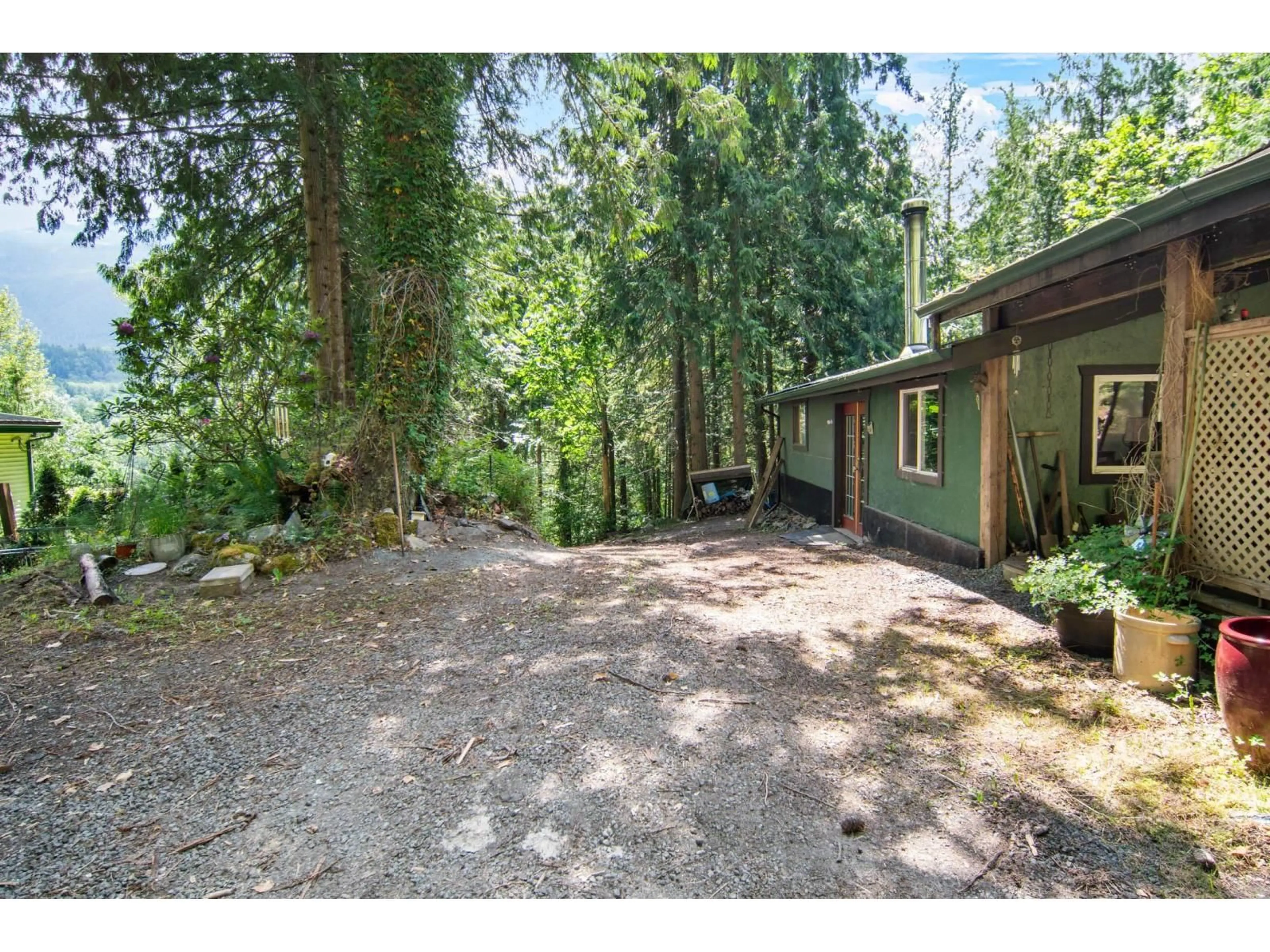 A pic from outside/outdoor area/front of a property/back of a property/a pic from drone, forest/trees view for 4139 SLESSE ROAD, Chilliwack British Columbia V4Z1B3