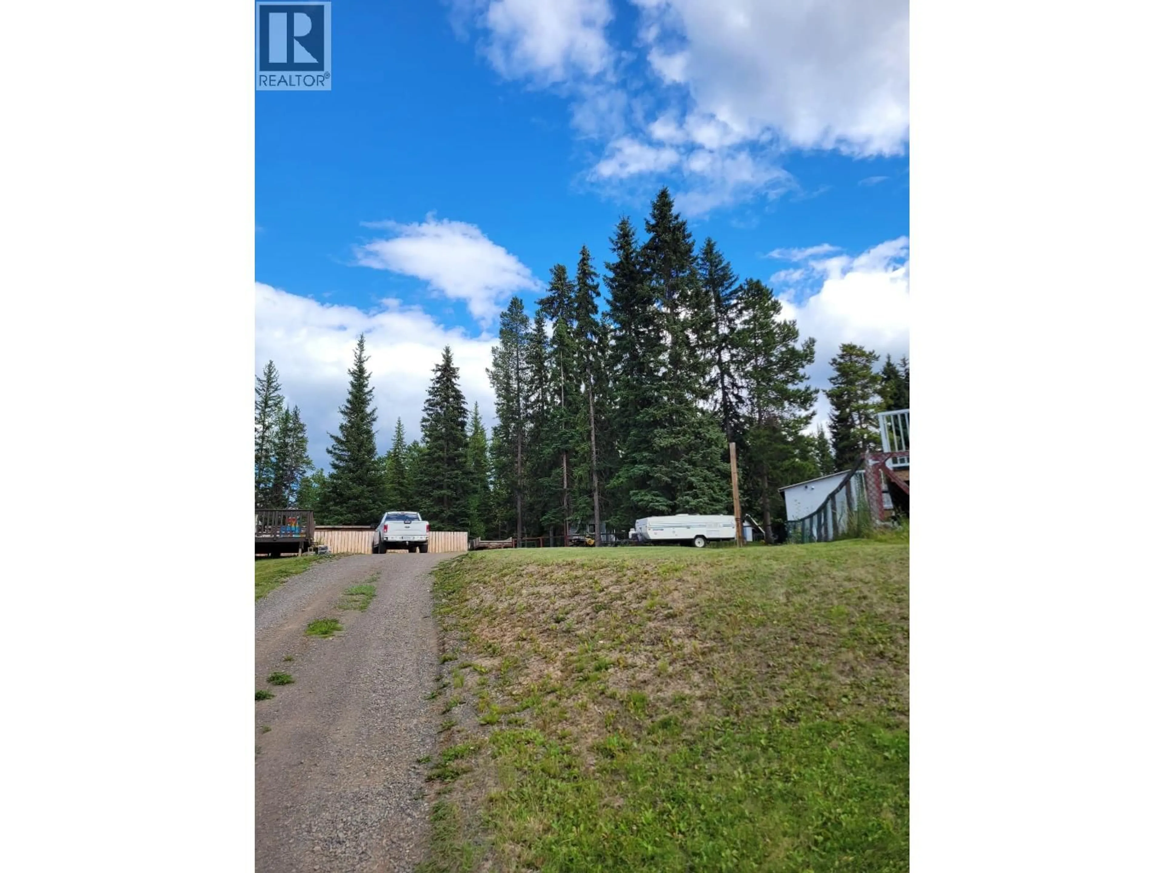 A pic from outside/outdoor area/front of a property/back of a property/a pic from drone, forest/trees view for 2330 OMINECA PLACE, Houston British Columbia V0J1Z2