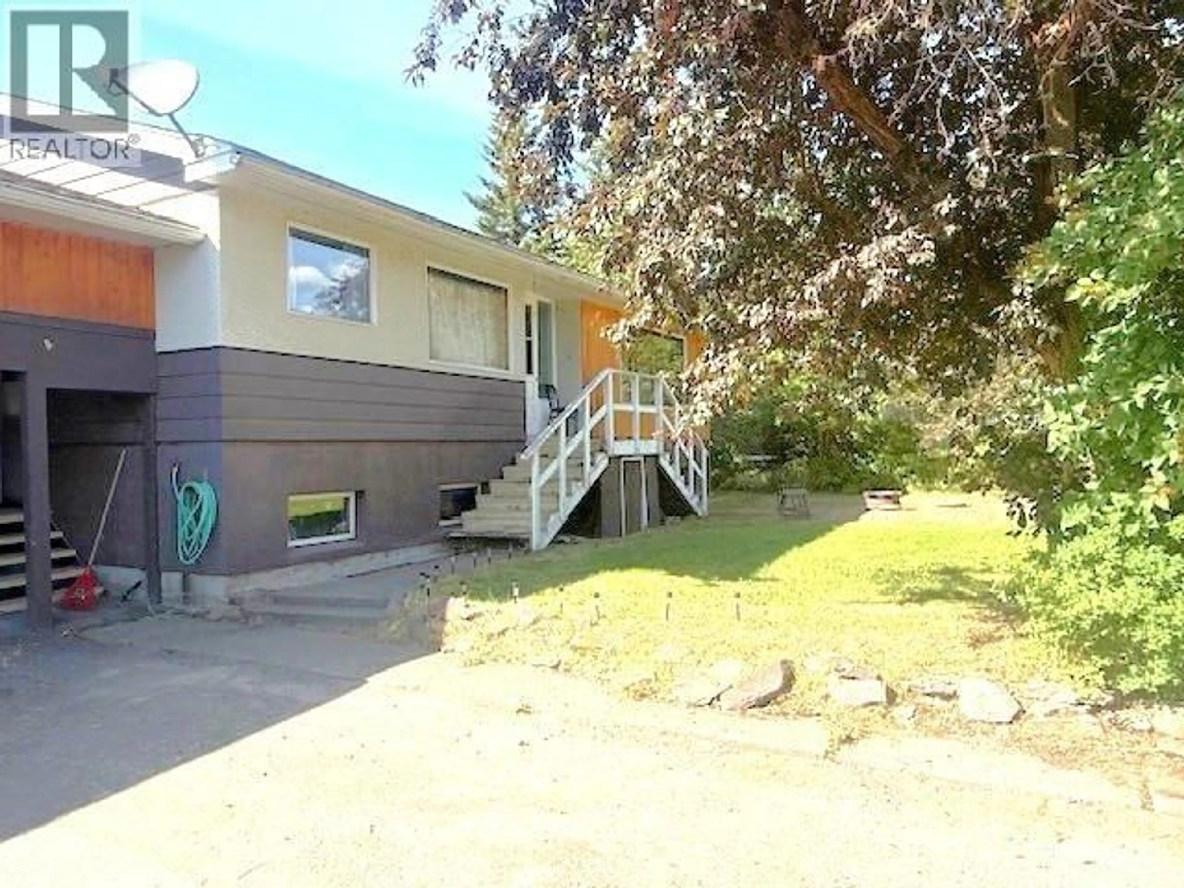 Home with vinyl exterior material, street for 3727 14TH AVENUE, Smithers British Columbia V0J2N0
