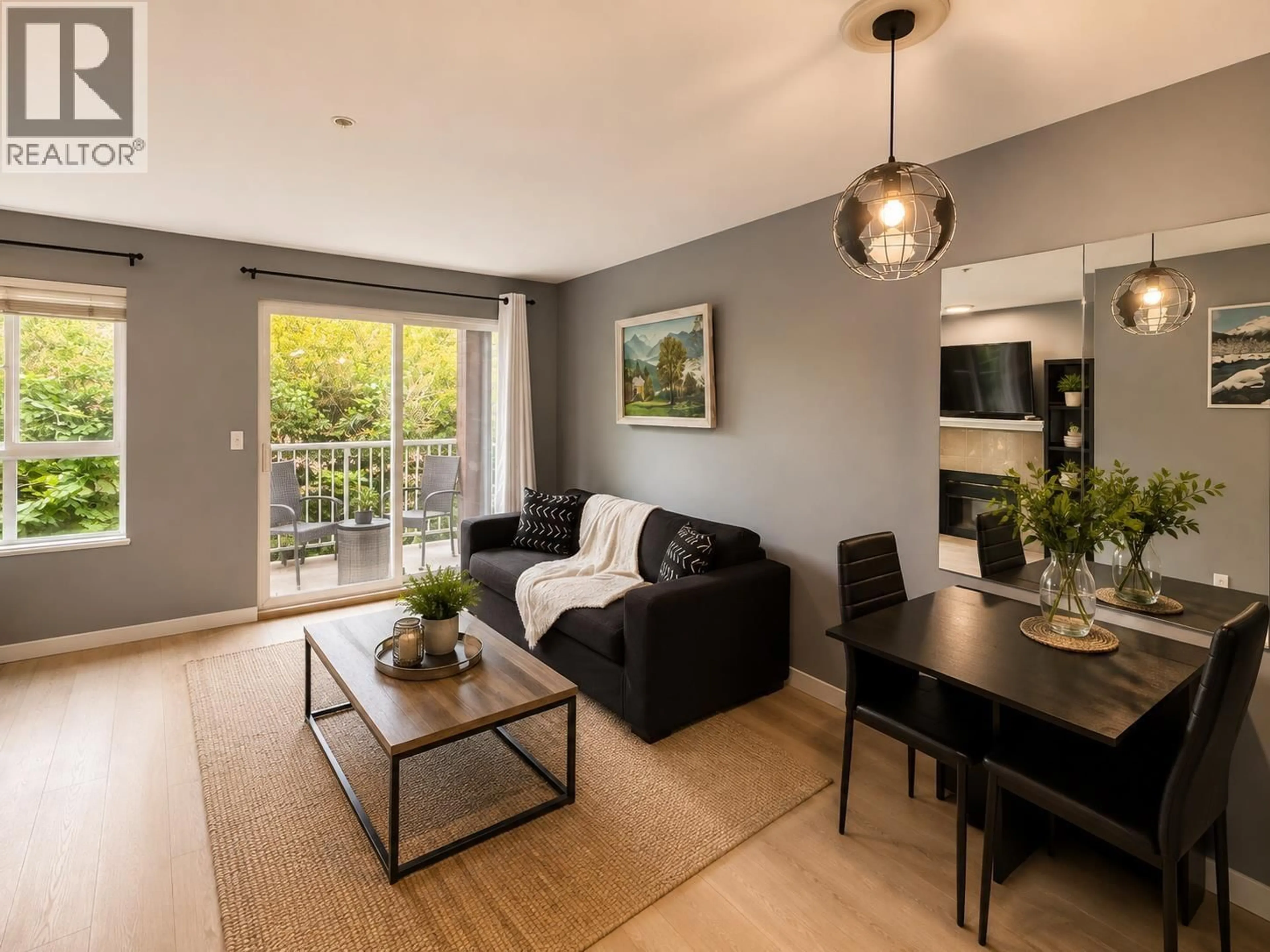 Living room with furniture, wood/laminate floor for 208 - 5355 BOUNDARY ROAD, Vancouver British Columbia V5R6G2