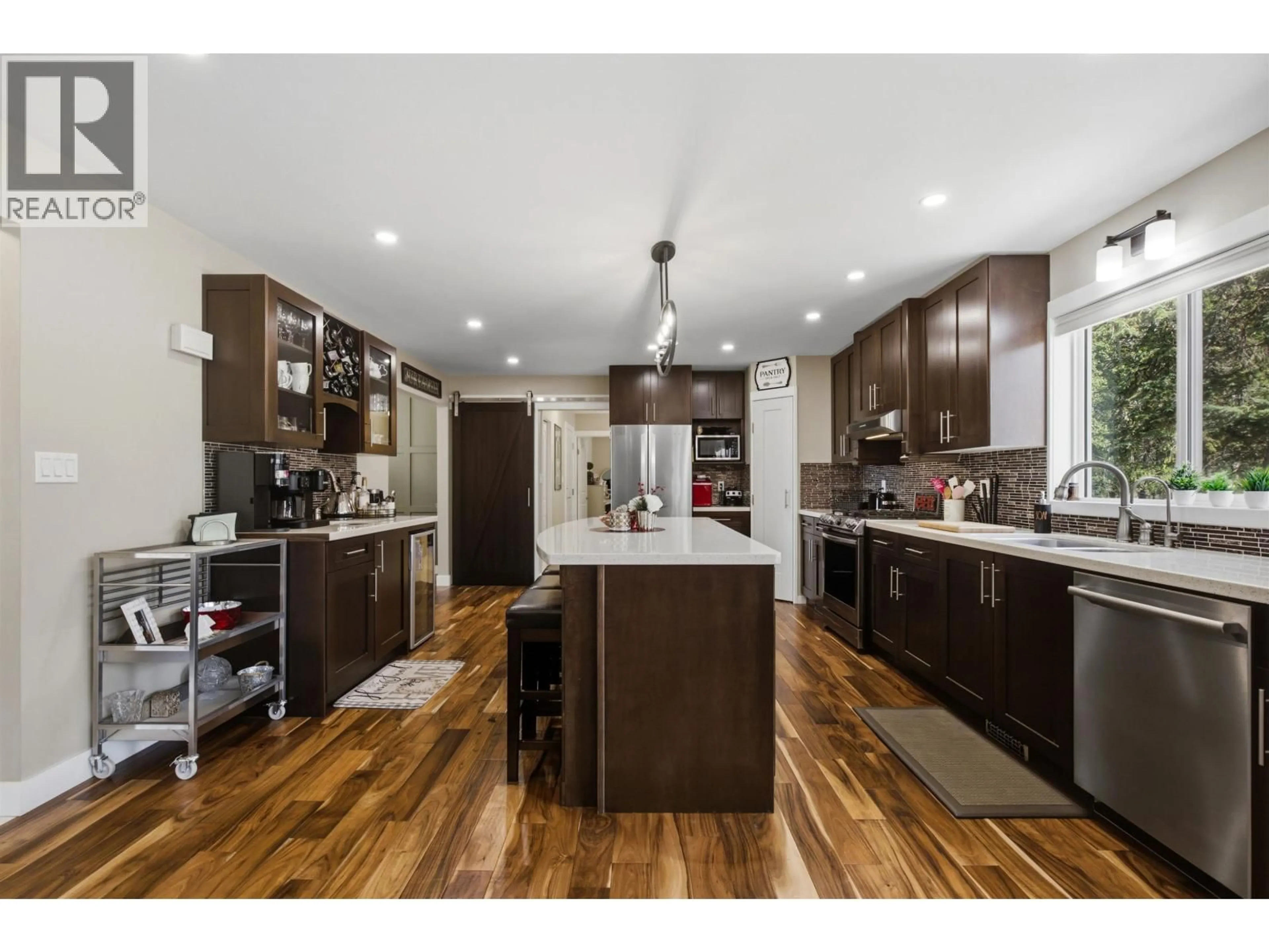 Open concept kitchen, wood/laminate floor for 511 TAMARACK ROAD, Williams Lake British Columbia V2G4J2