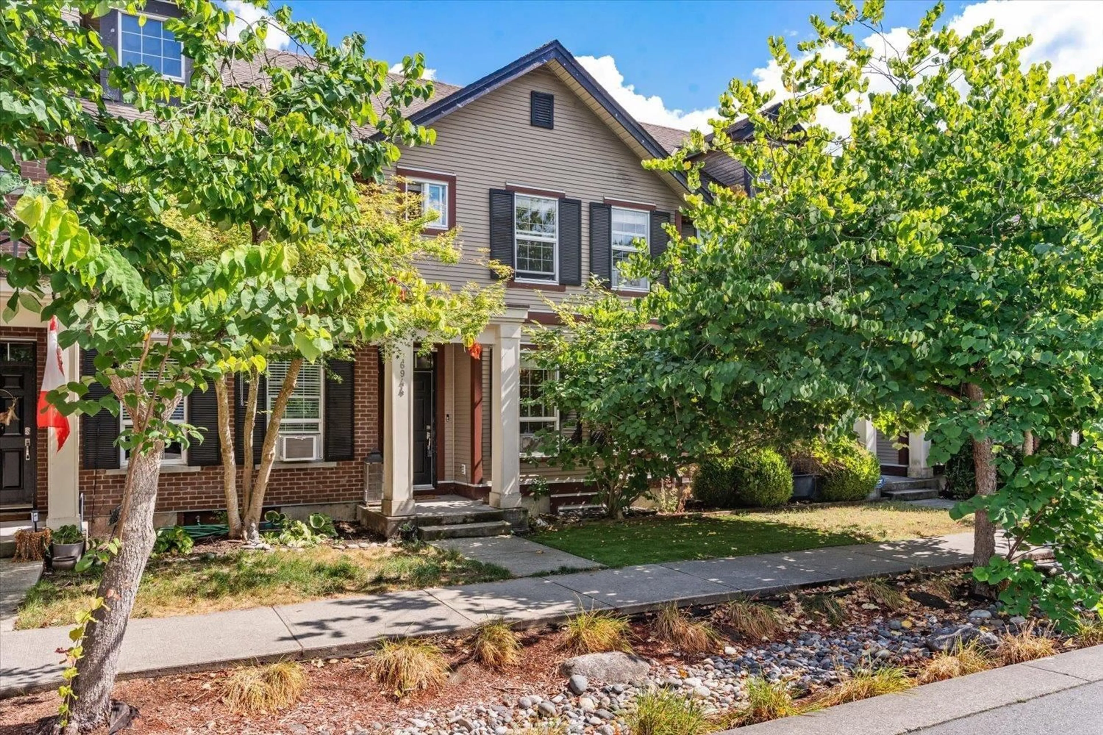Home with brick exterior material, street for 6944 208A STREET, Langley British Columbia V2Y0G1