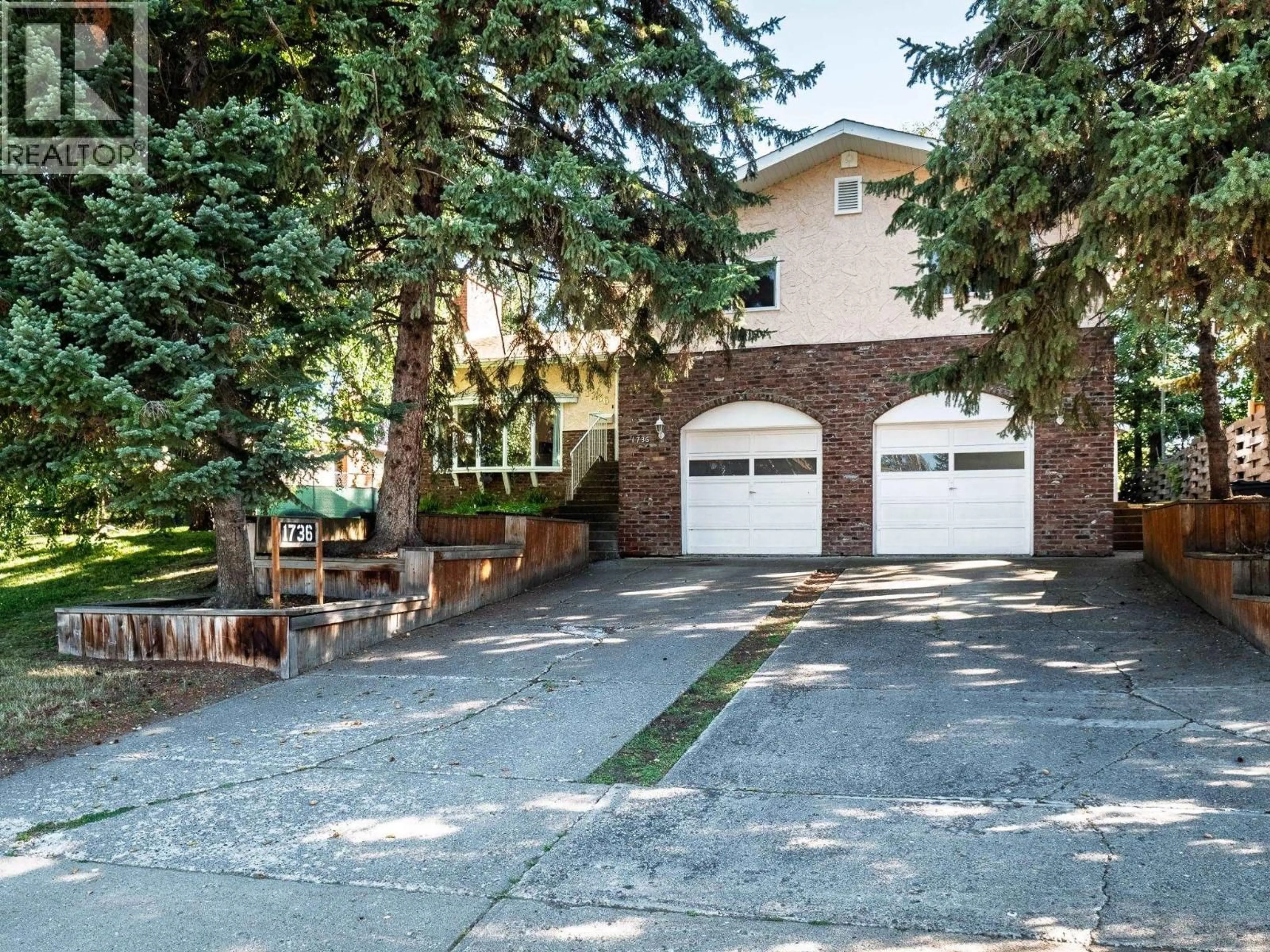 Home with brick exterior material, street for 1736 PEARSON AVENUE, Prince George British Columbia V2L4K8