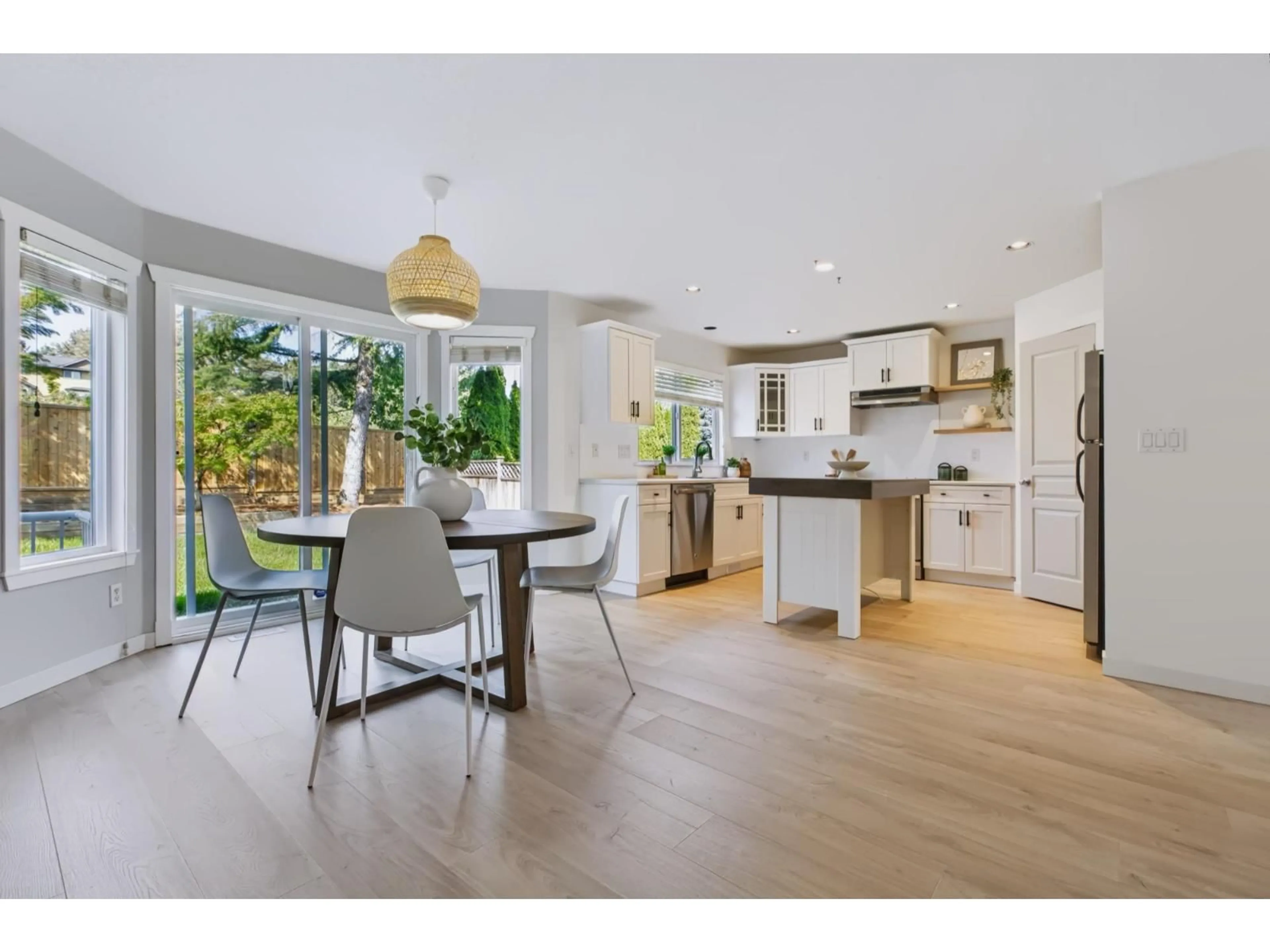 Open concept kitchen, wood/laminate floor for 20613 66A AVENUE, Langley British Columbia V2Y2Y4